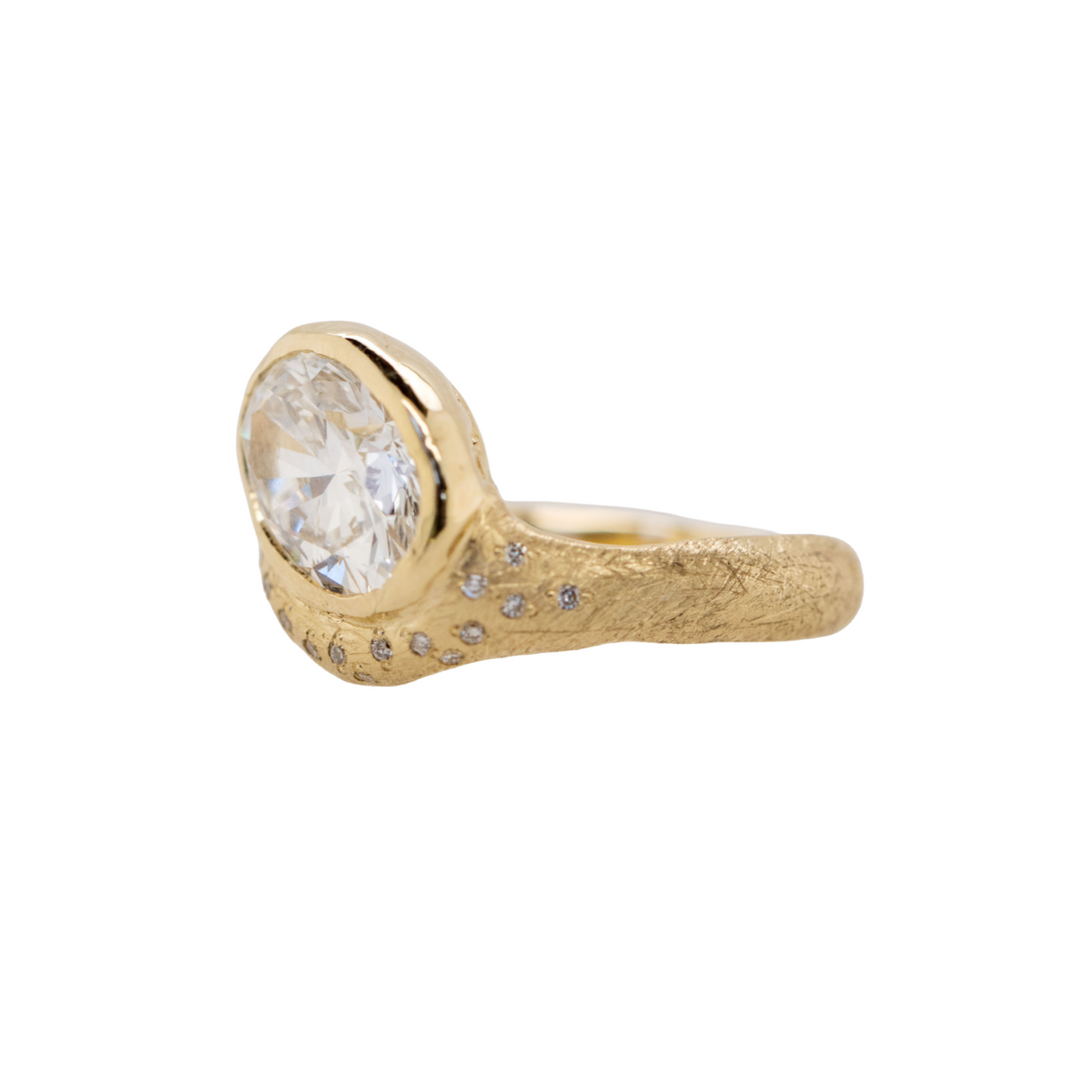14k gold round engagement ring with organic band with scattered white diamonds on white background