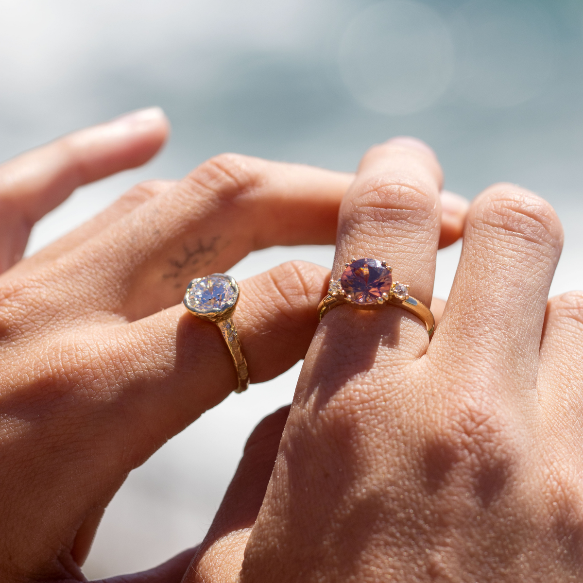 14k gold organic bezel set diamond engagement ring in lifestyle shot