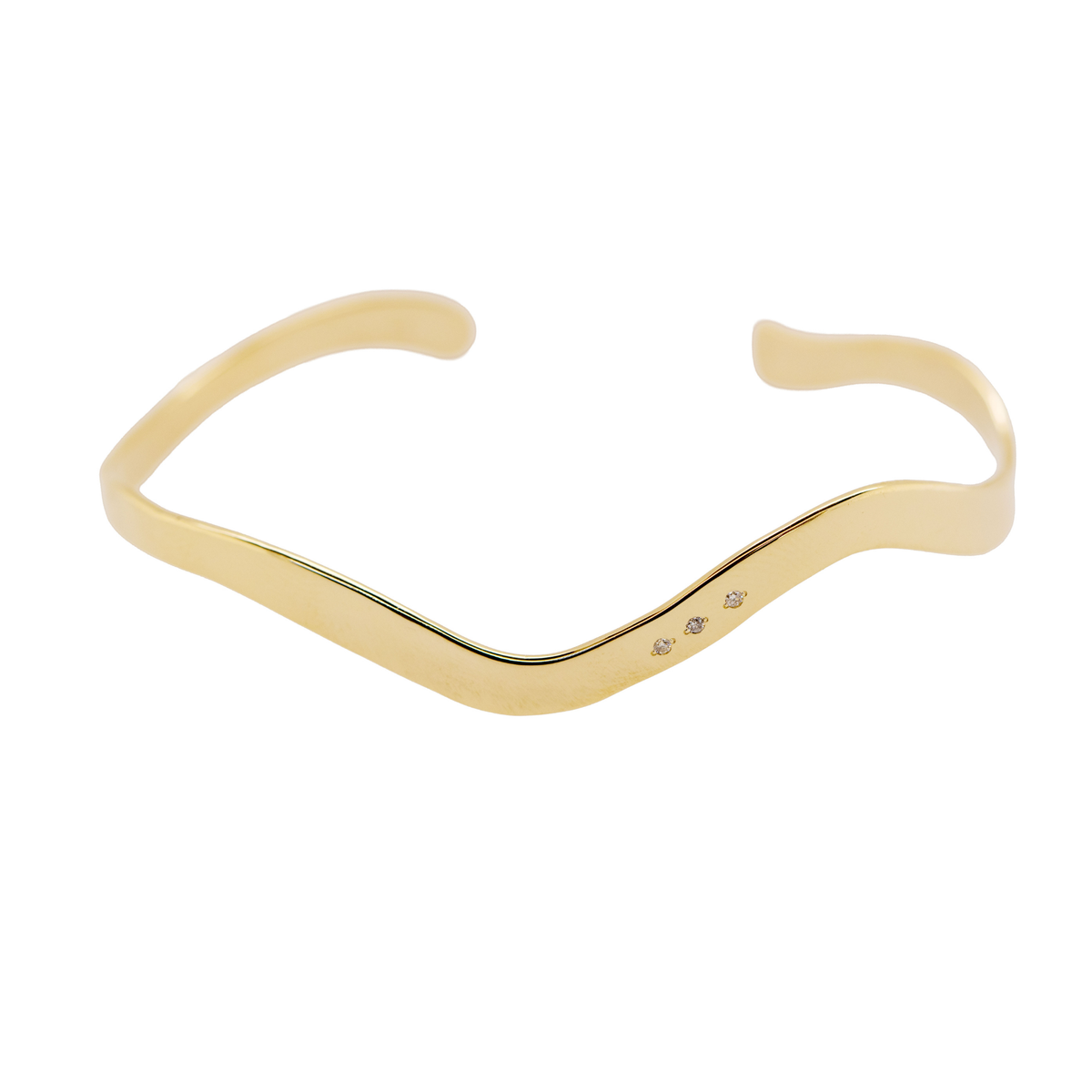 14k gold sculptural cuff with 3 round white diamonds on white background