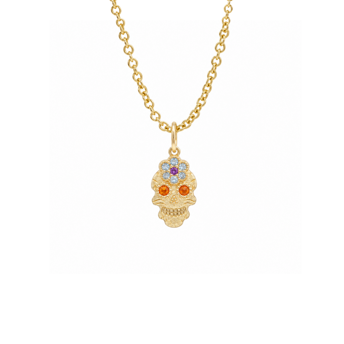14k gold skor pendant with raised flower and sapphire eyes on white background