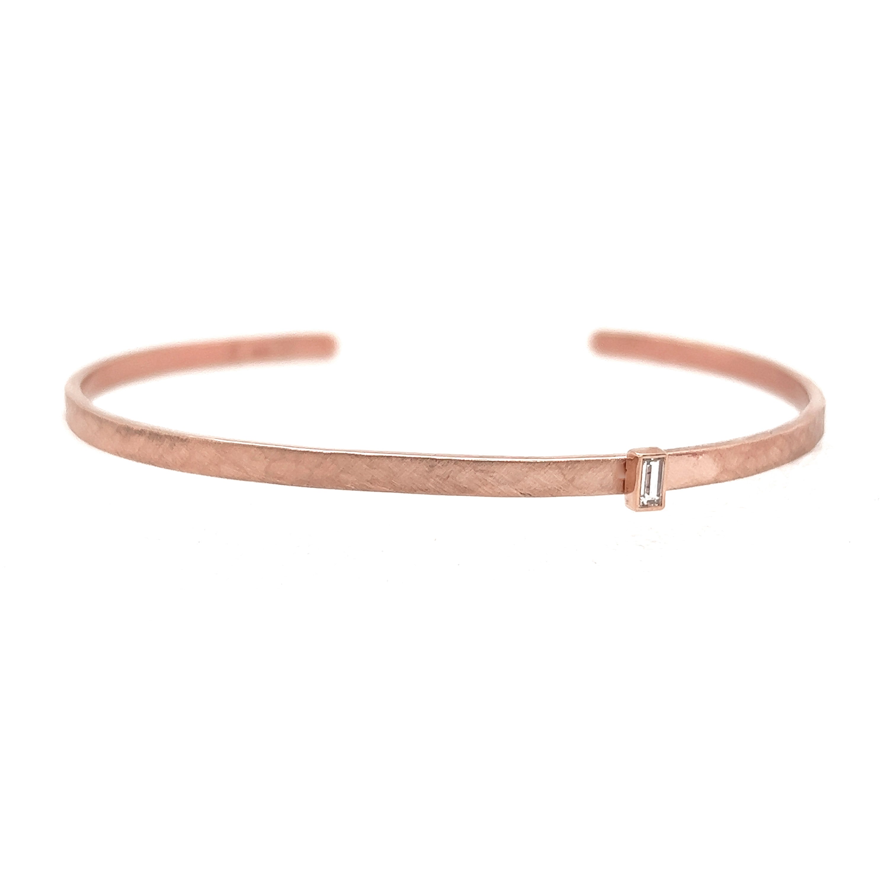 14k rose gold hammered open cuff with baguette white diamond on white background