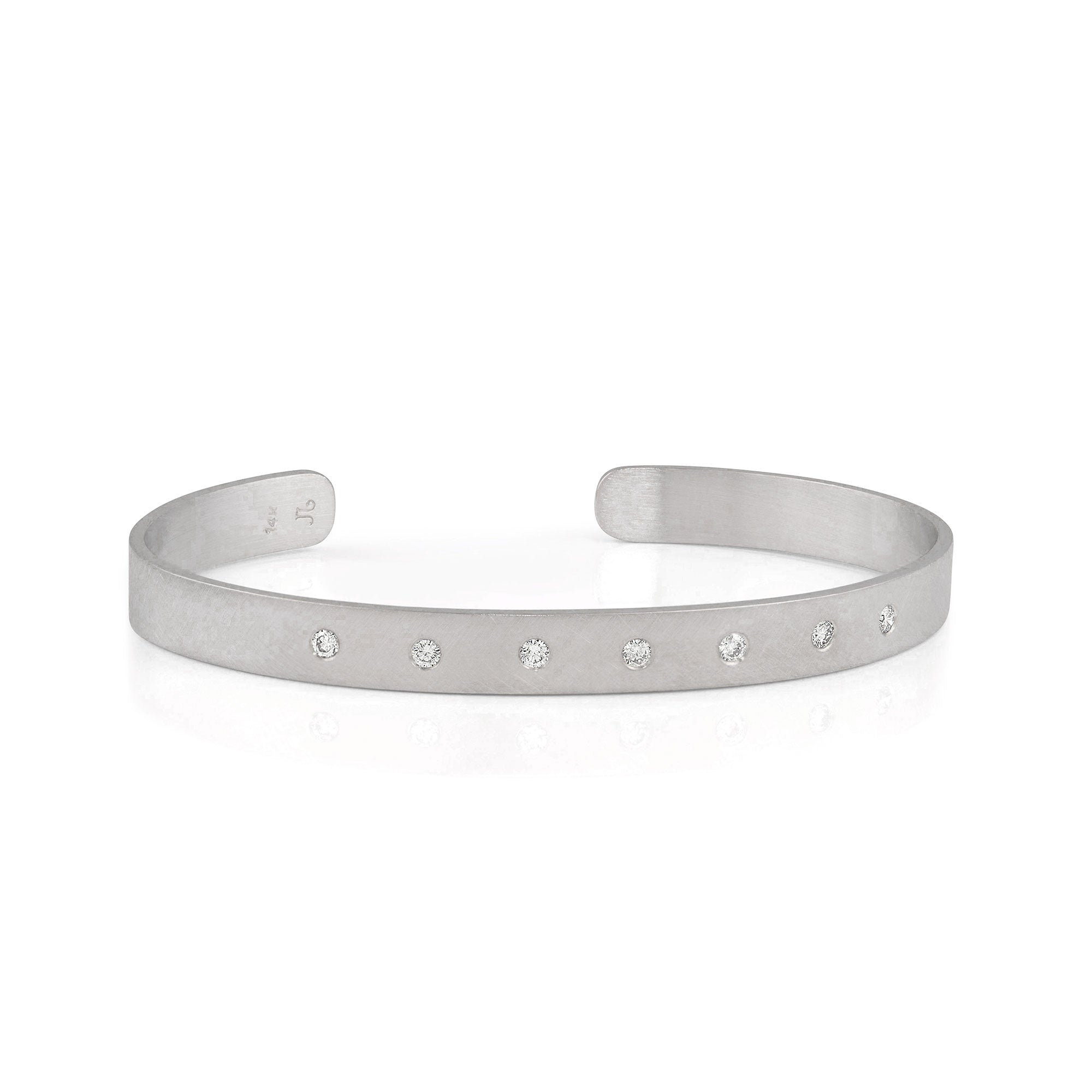 14k white gold satin cuff bracelet with white diamonds on white background