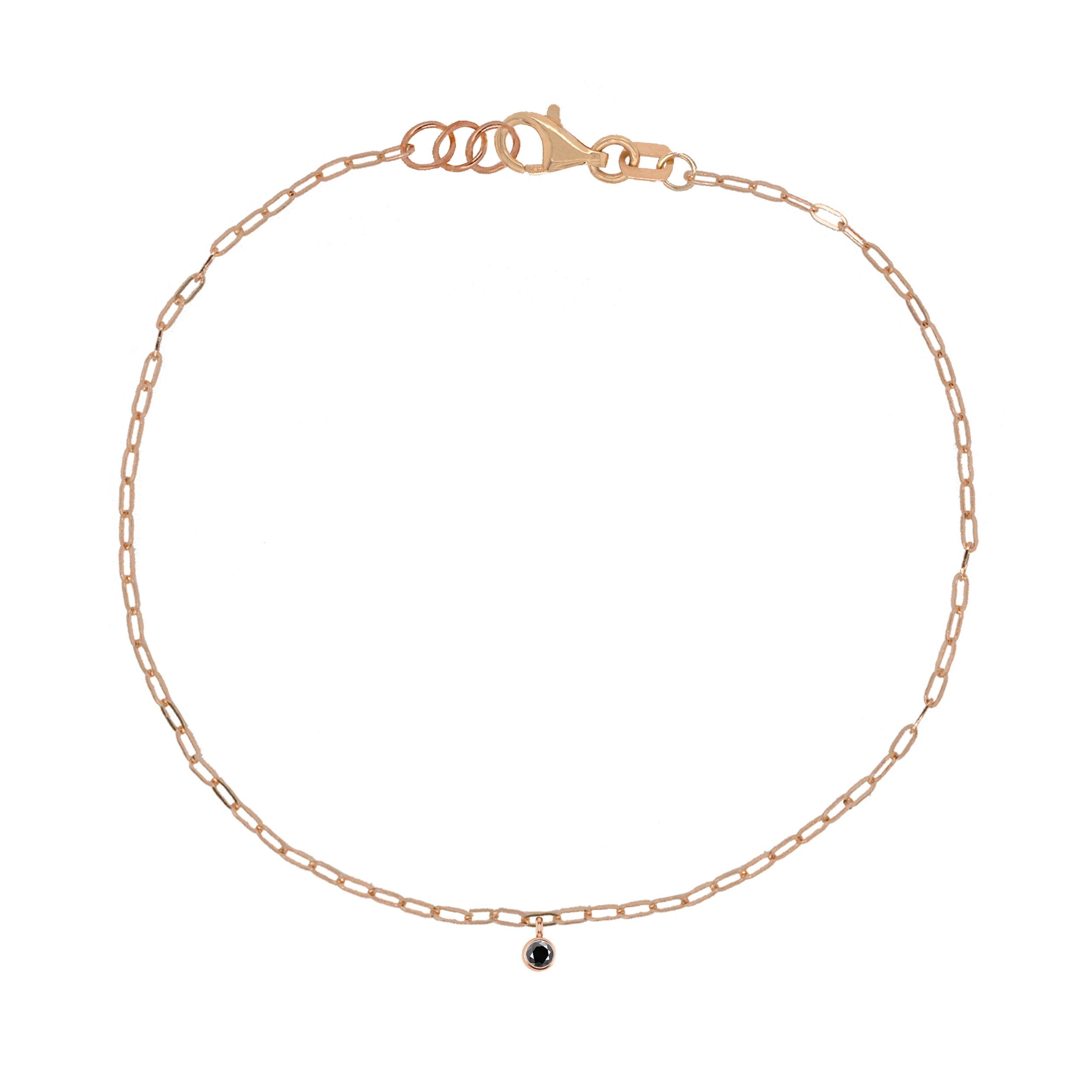 14k rose gold paperclip chain bracelet with bezel set gemstone charm on white background