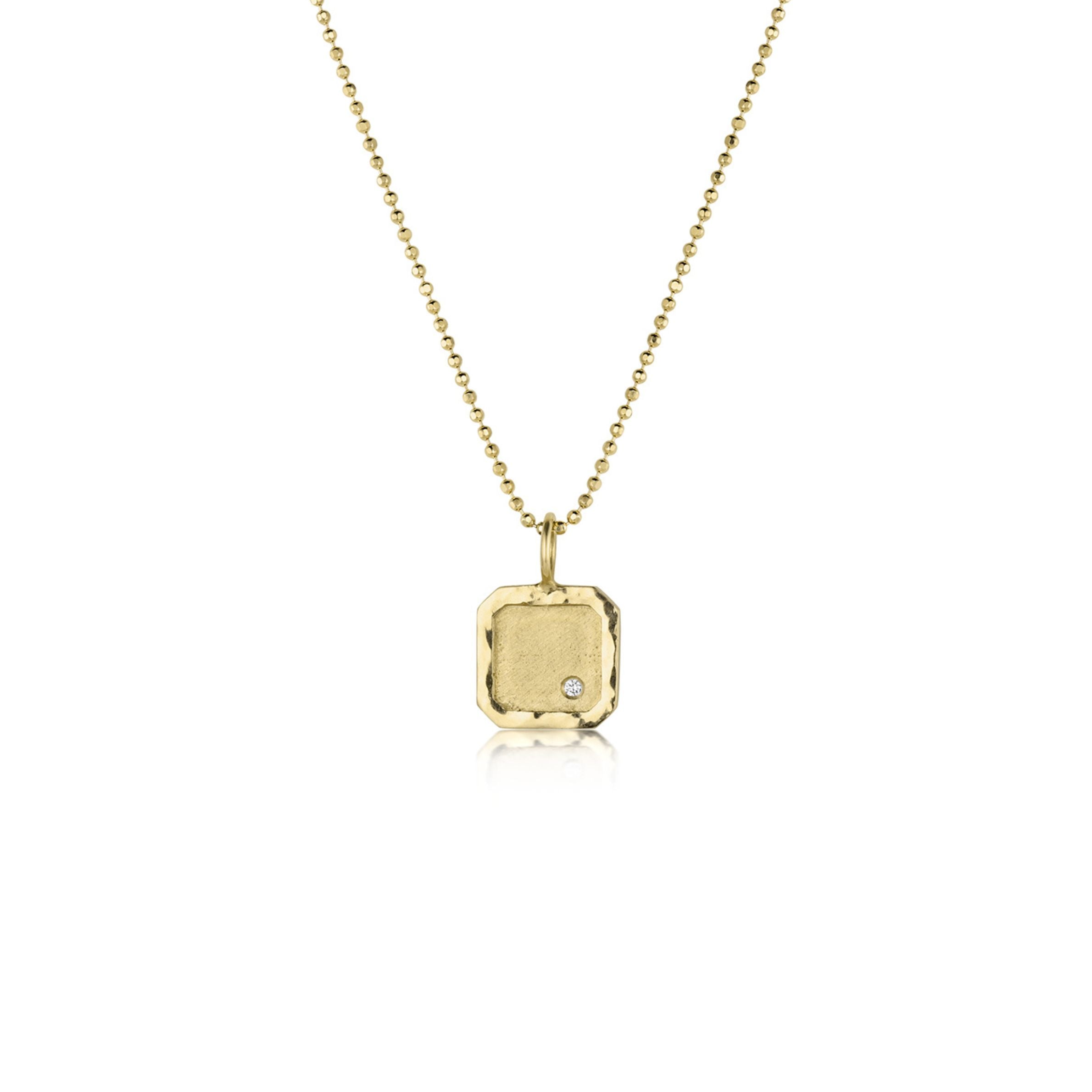 14k gold square dog tag necklace featuring hammer texture high polish border with textured interior and single stone diamond accent pendant shown on ball chain on a white background