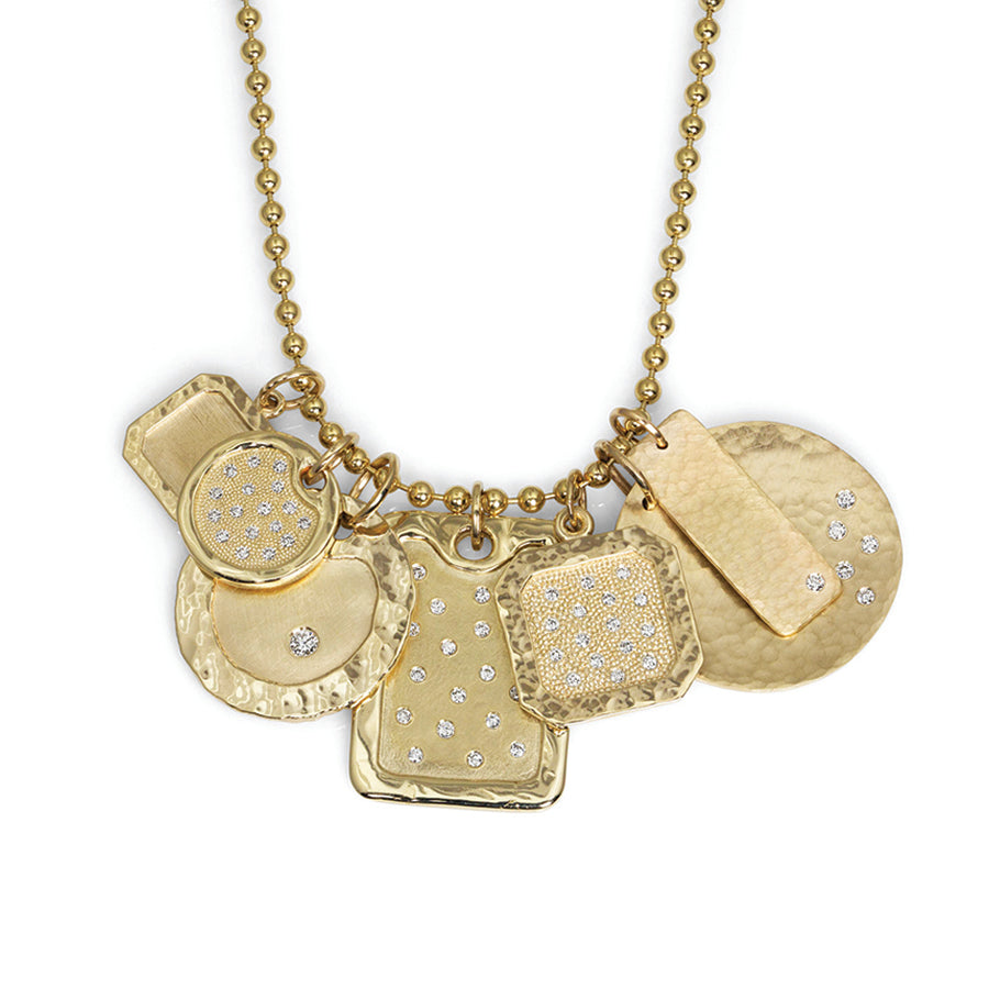 14k yellow gold group shot of square satin dogtag pendants with white diamonds and round pendants with beaded textures and scattered white diamonds on ball chain on white background