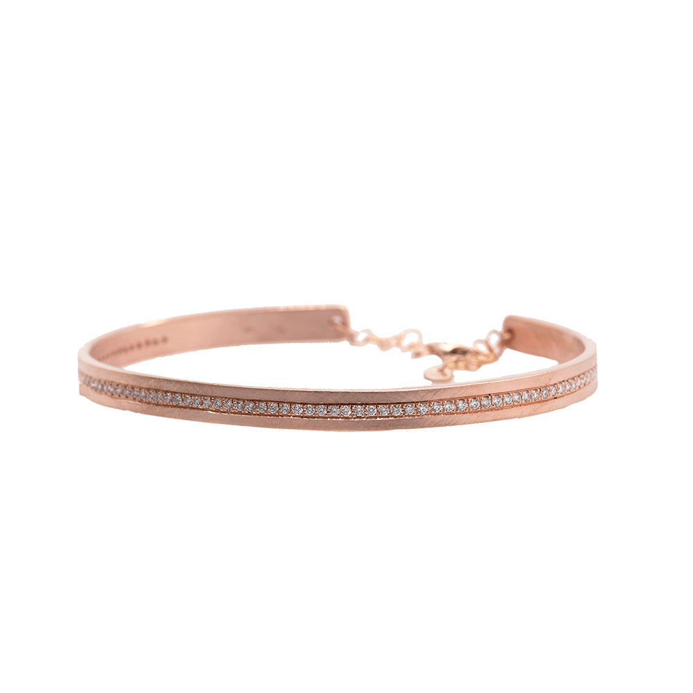 14k rose gold pave set white diamond cuff bracelet with an adjustable chain on white background
