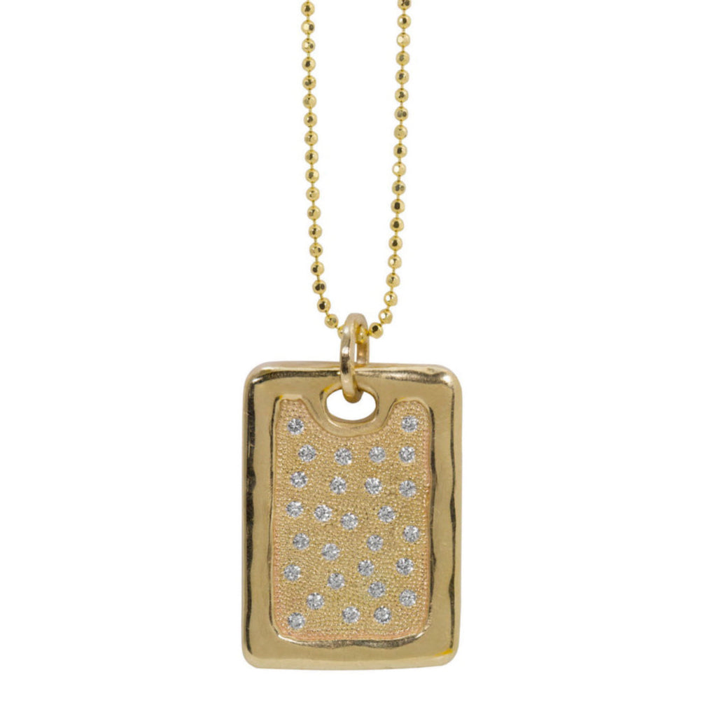 Large 14k yellow gold rectangular dog tag pendant featuring high polished edge and scattered bead set white diamonds shown on diamond cut ball chain with white background