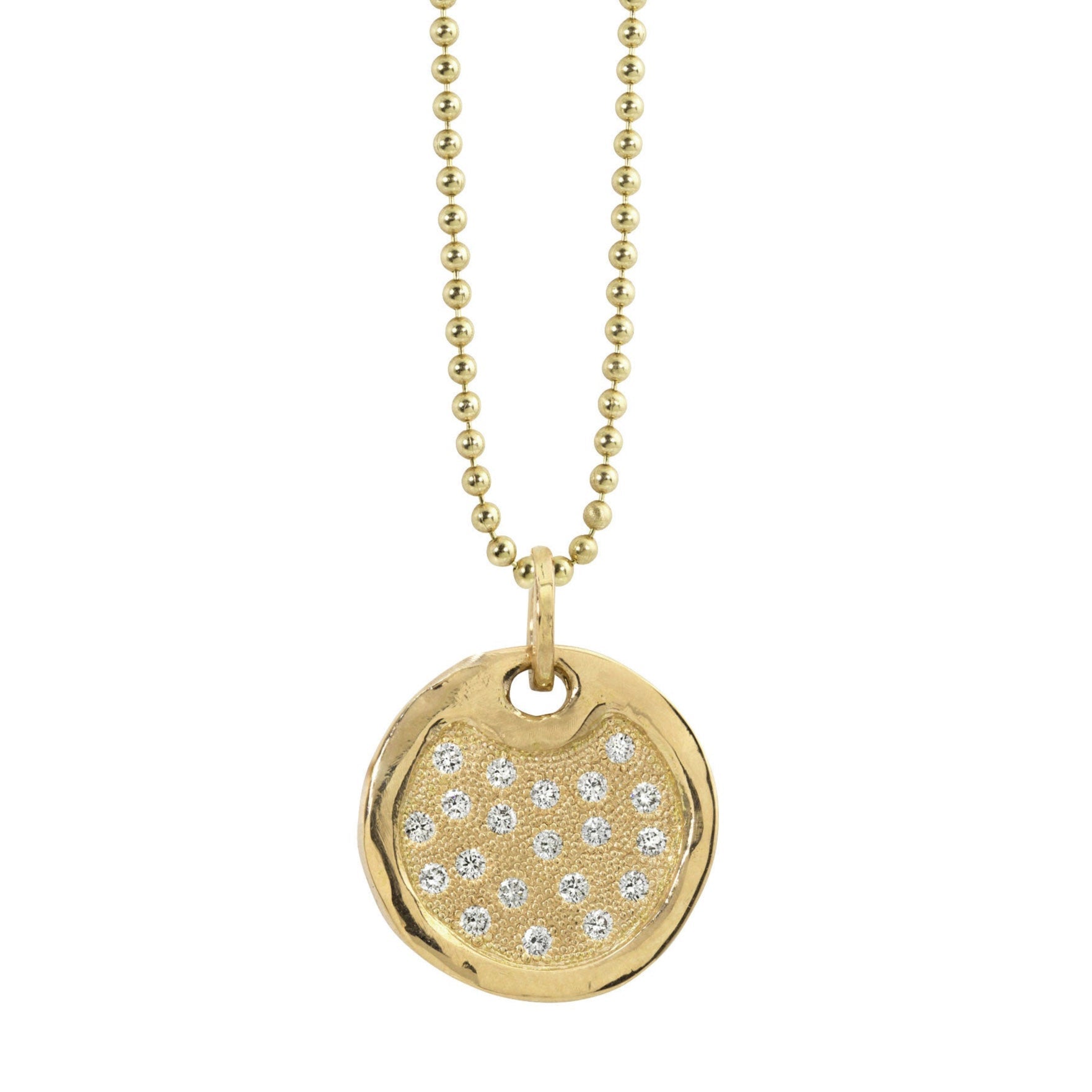 14k gold round dog tag necklace featuring scattered white bead set diamonds shiny polished border hanging from ball chain on a white background