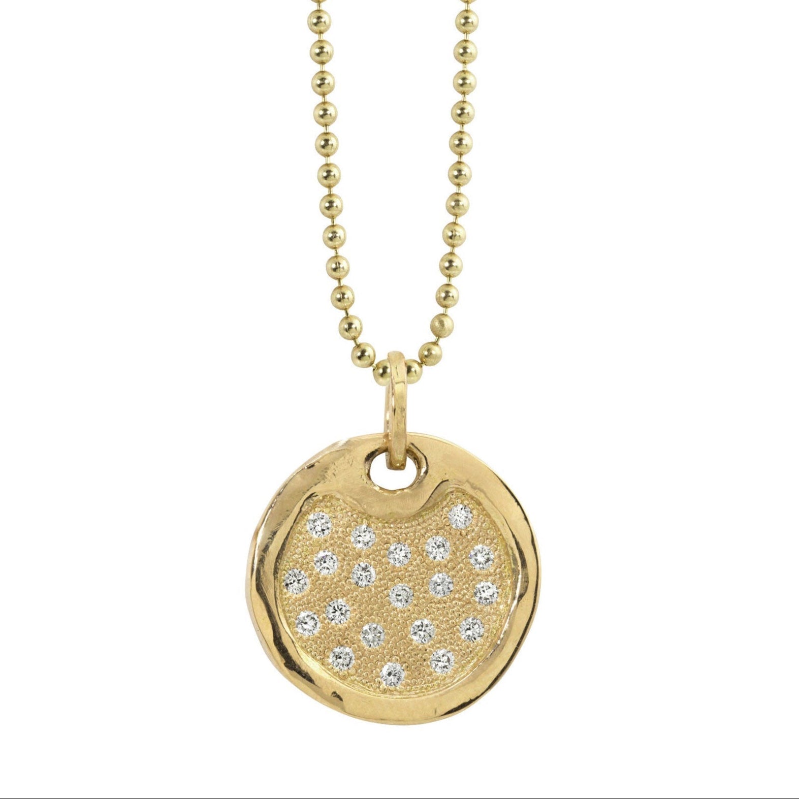 14k gold round dog tag necklace featuring scattered white bead set diamonds shiny polished border hanging from ball chain on a white background