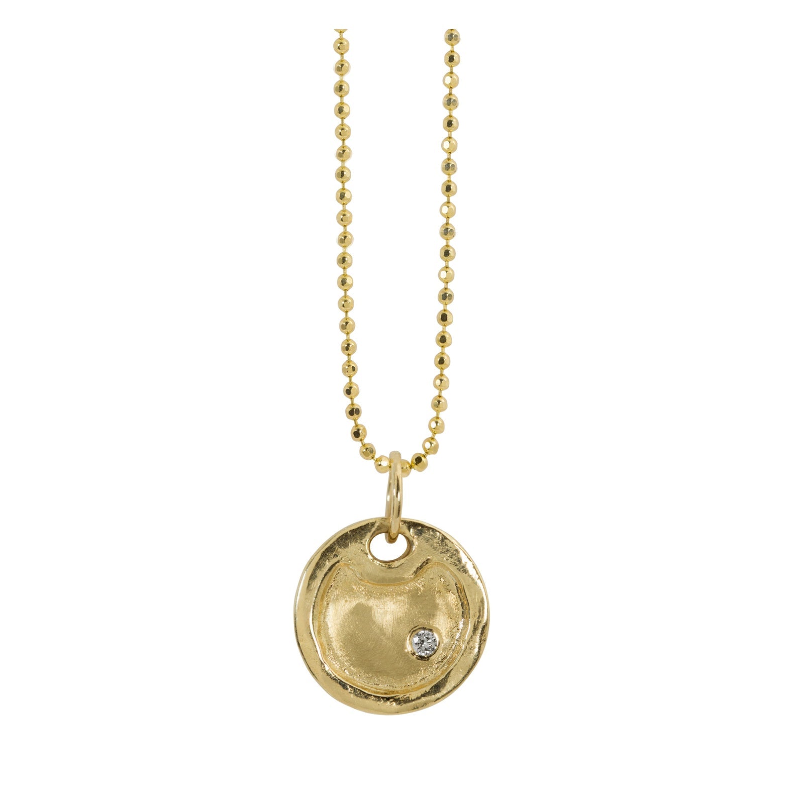 Small round dog tag pendant with raised polished border and single stone diamond accent hanging from diamond cut ball chain shown on white background