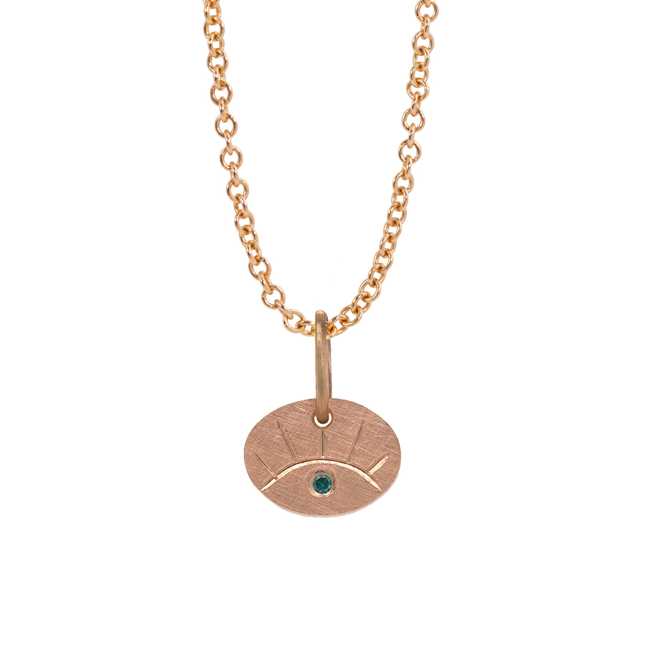 14k rose gold eye pendant featuring hand etching and colored sapphire on a rolo chain on a white background