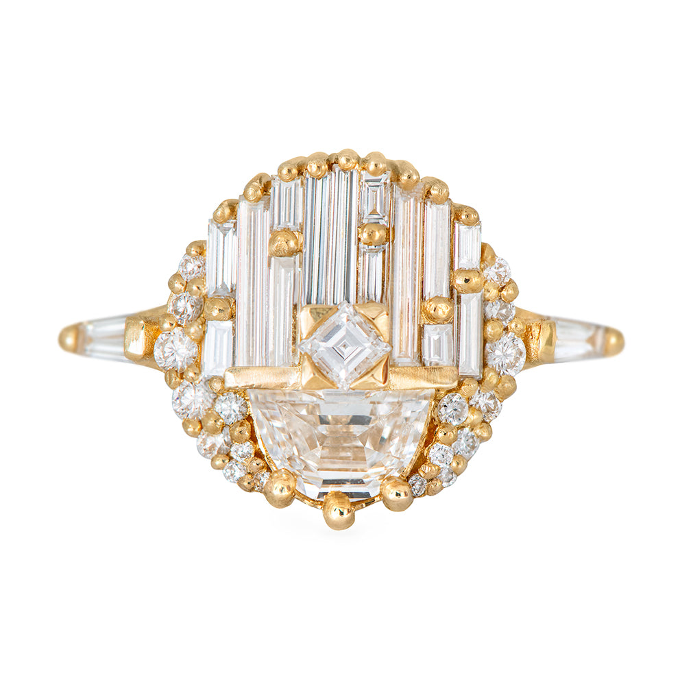 Gold and diamond ring on a white background