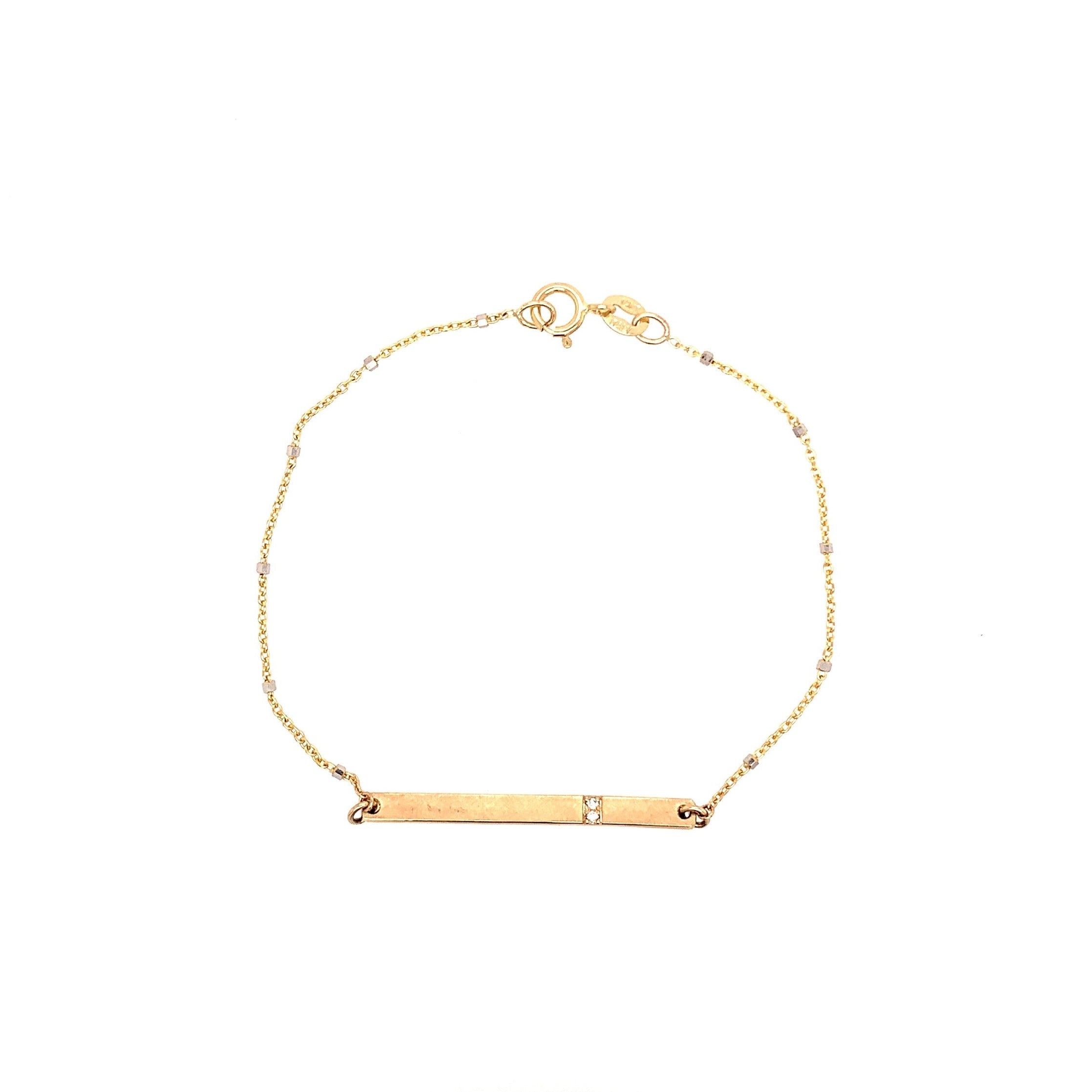 14k yellow gold bar bracelet with white diamond accents on ice cube chain on white background