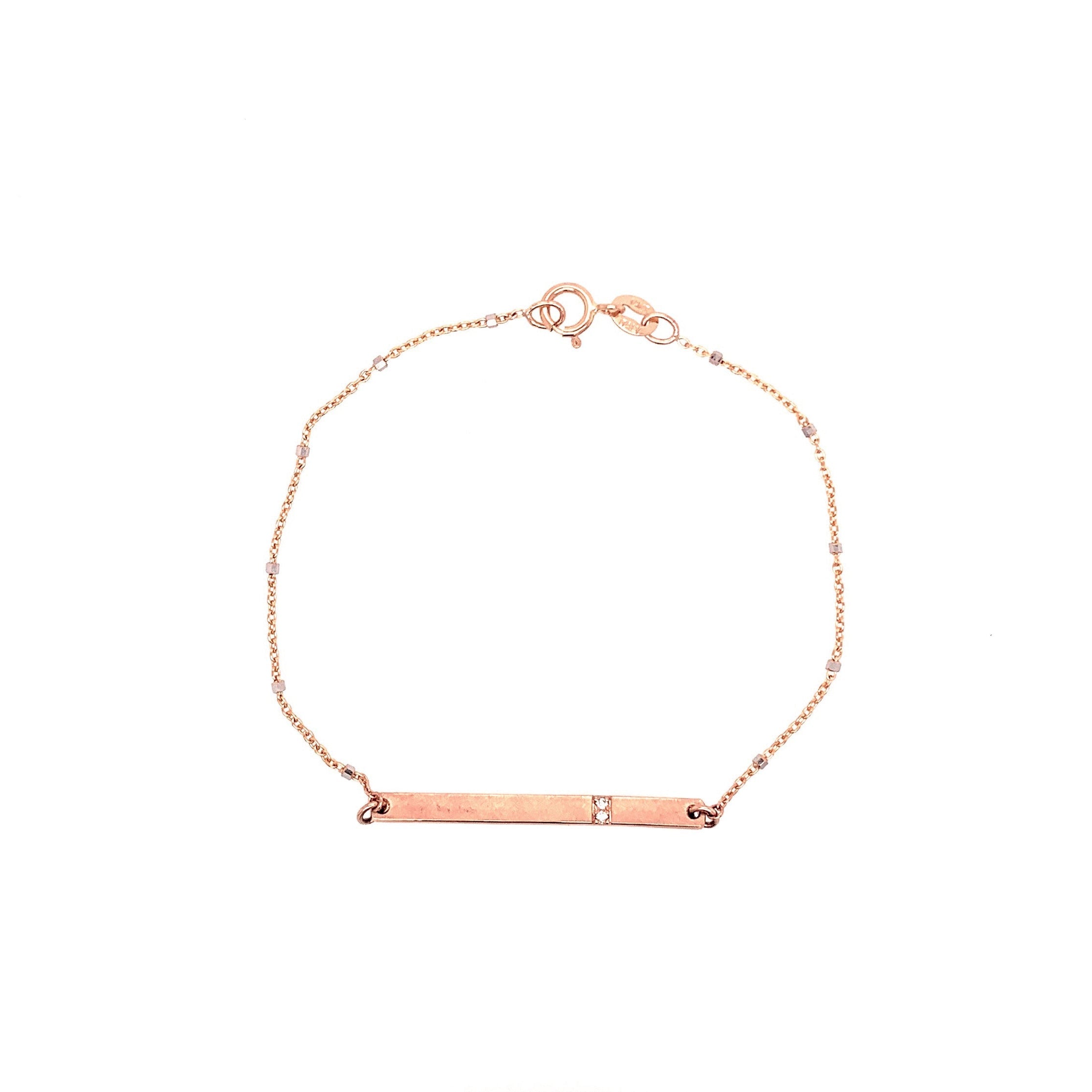 14k rose gold bar bracelet with white diamond accents on ice cube chain on white background