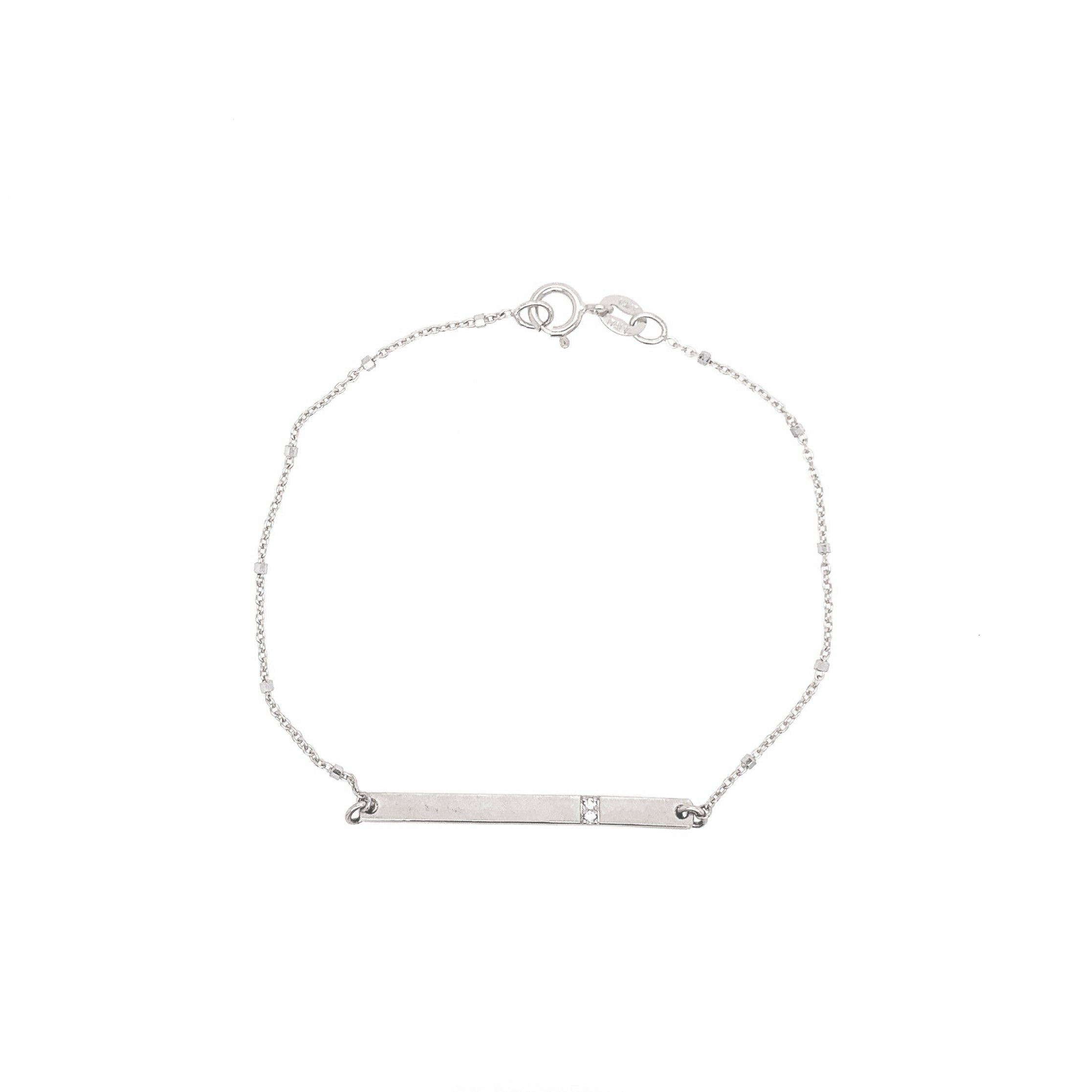 14k white gold bar bracelet with white diamond accents on ice cube chain on white background