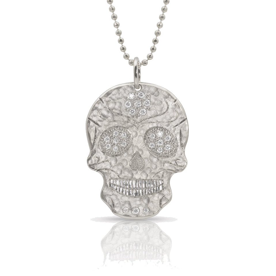 14k white gold ghostrider skull pendant with hammered satin finish and white diamond accents on diamond cut ball chain on a white background