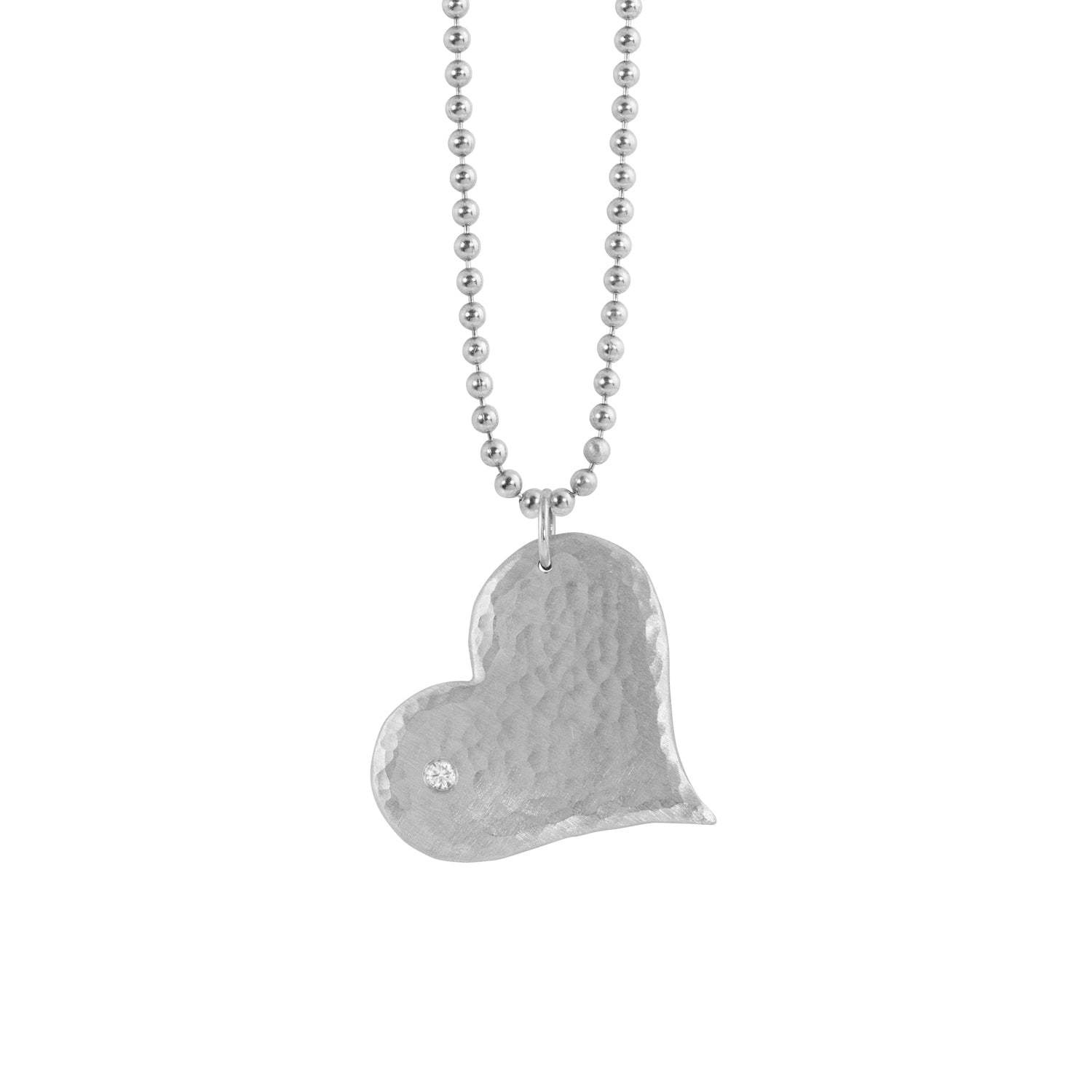 14k white gold hammered heart-shaped pendant with a white diamond on a ball chain on a white background
