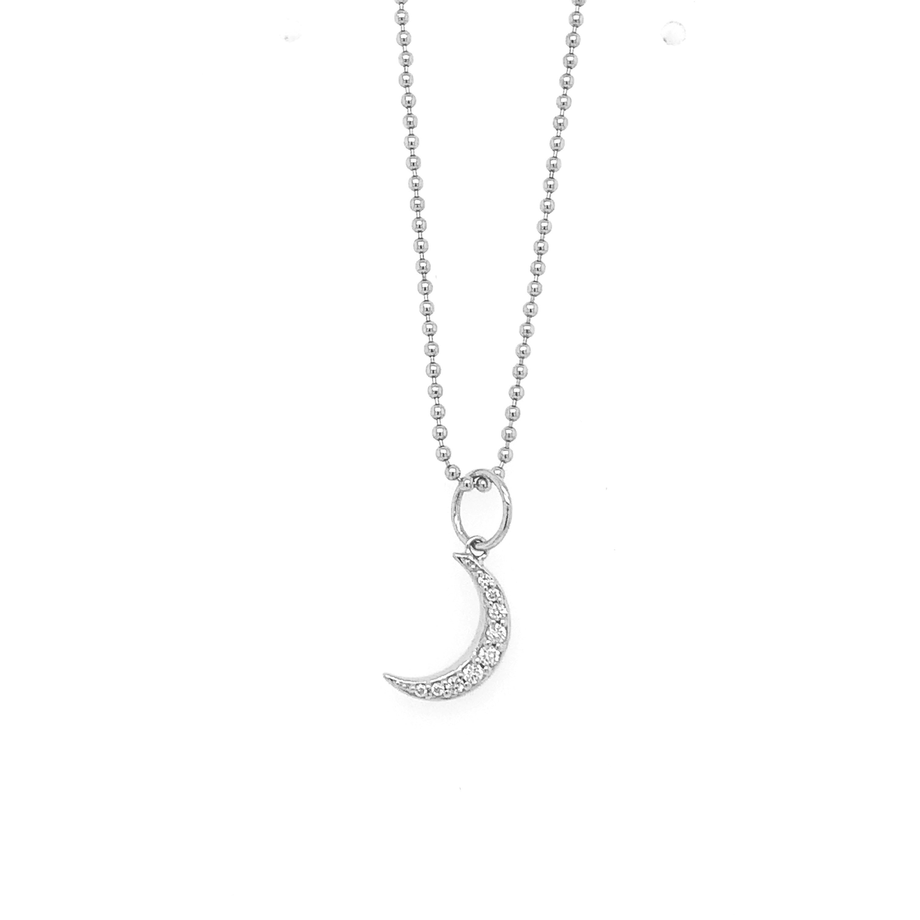 14k white gold crescent moon pendant with white diamonds on ball chain on a white background