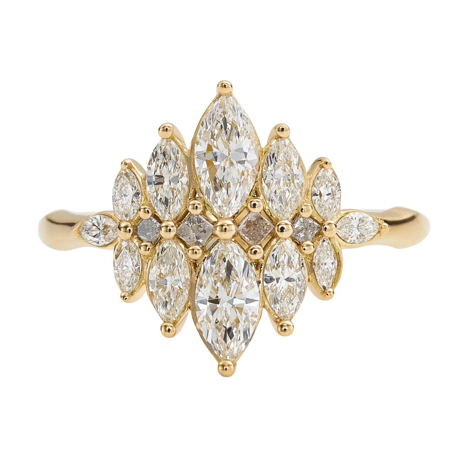Gold ring with marquise-shaped diamonds on a white background