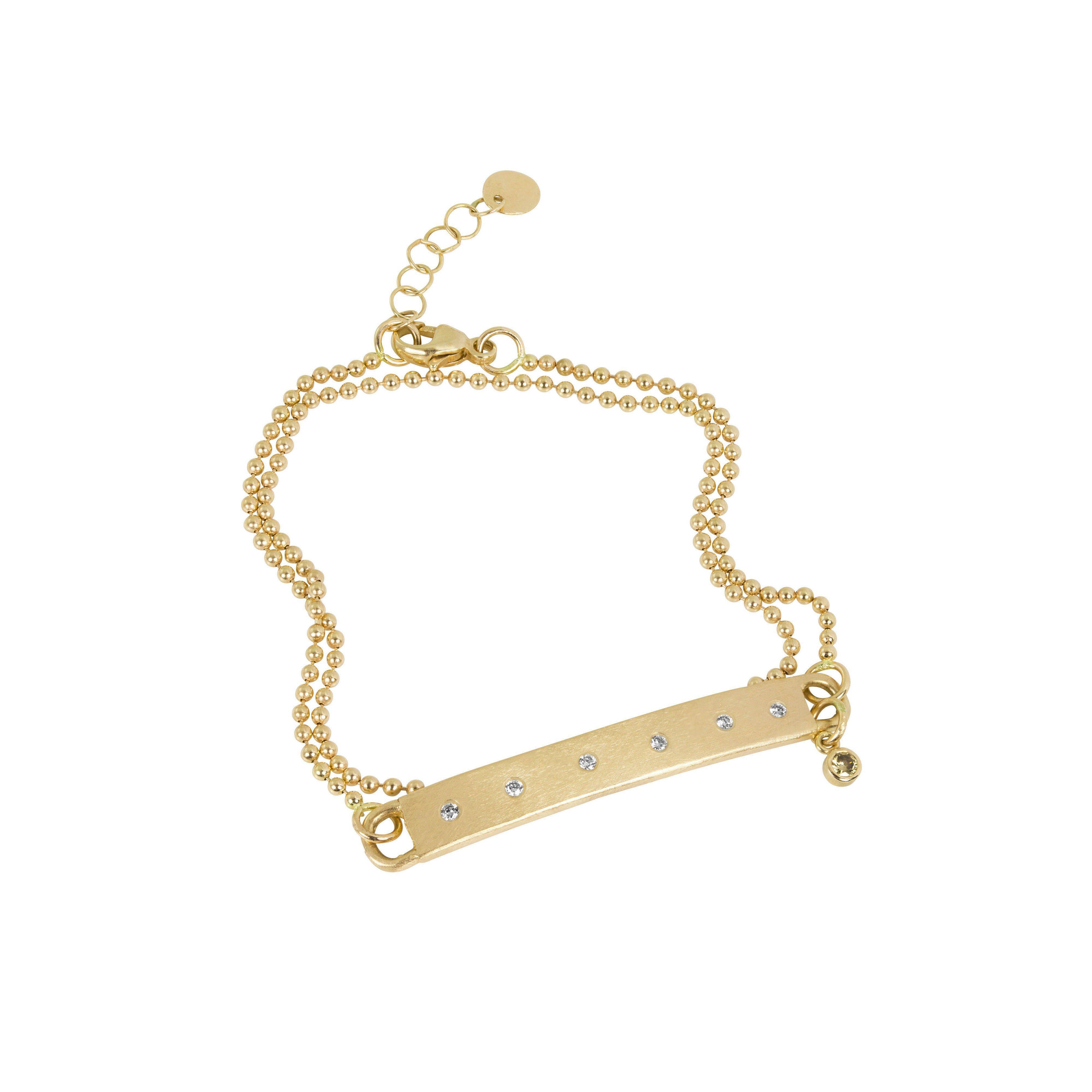 14k yellow gold bar wrap bracelet with white diamonds and wrap around ball chain with bezi accent charm on white background