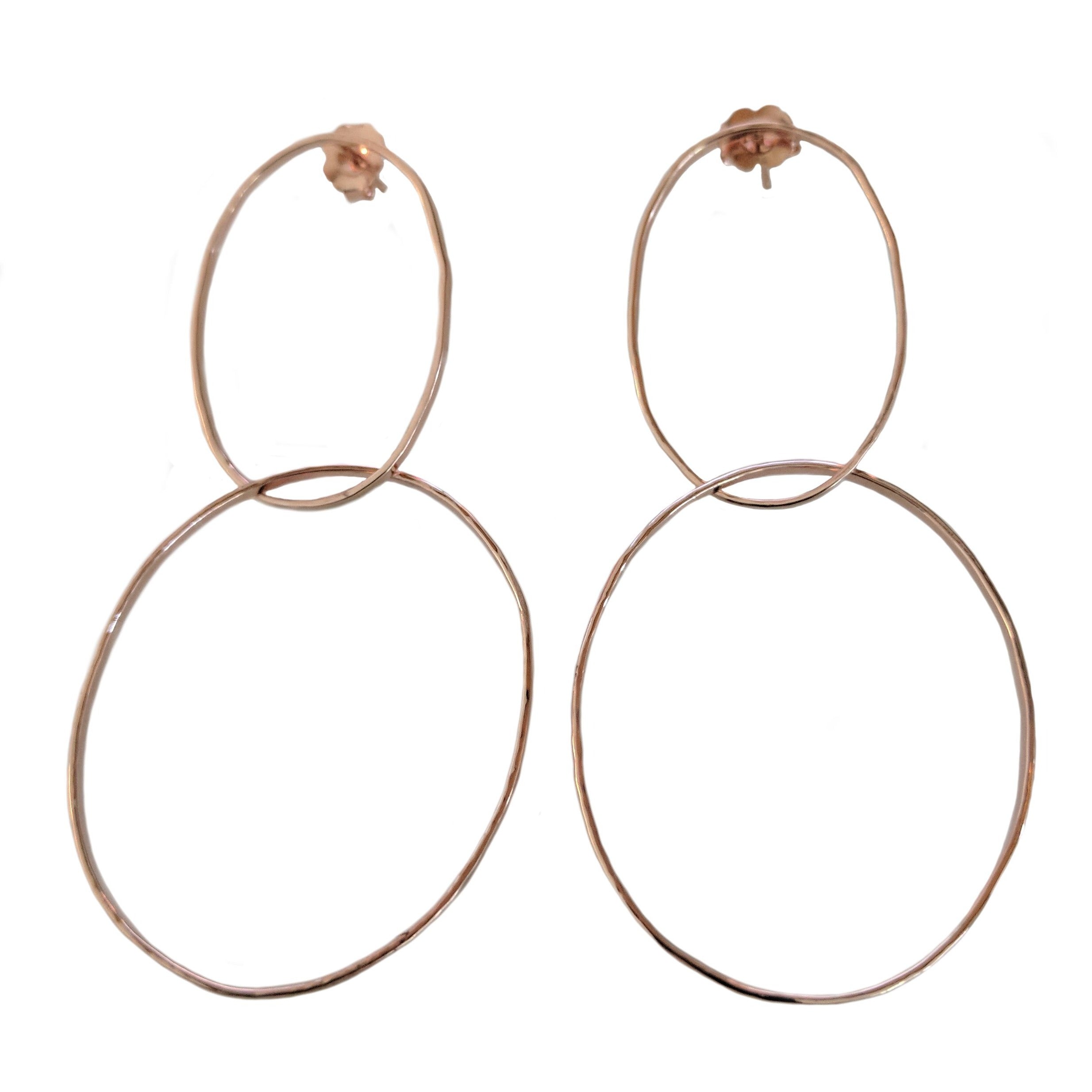 14k rose gold double intersecting hoop earrings with posts shown on white background