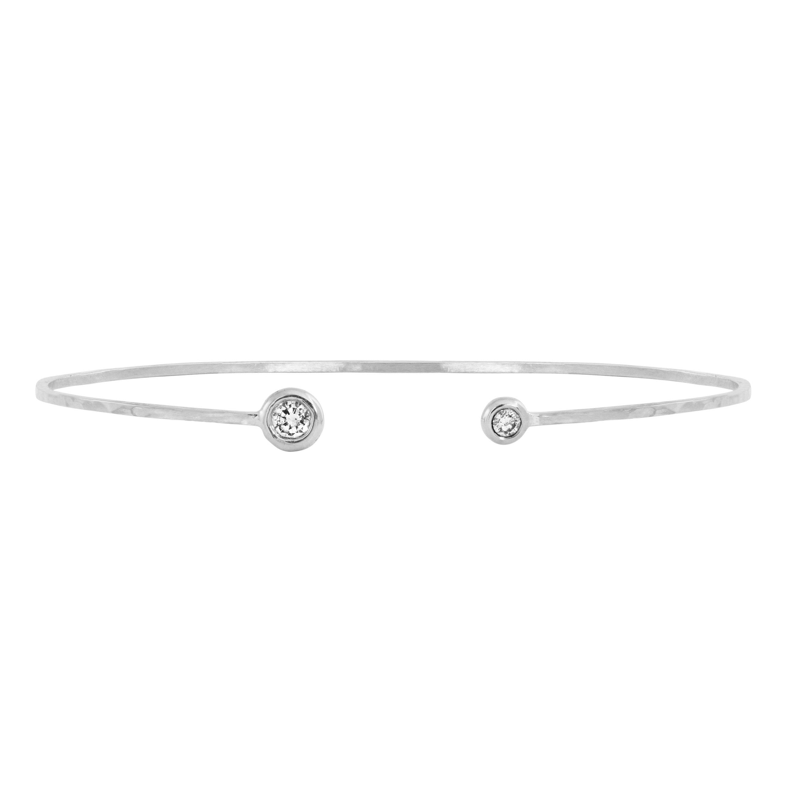 14k white gold wire paddle bracelet with two bezel set white diamonds on white background
