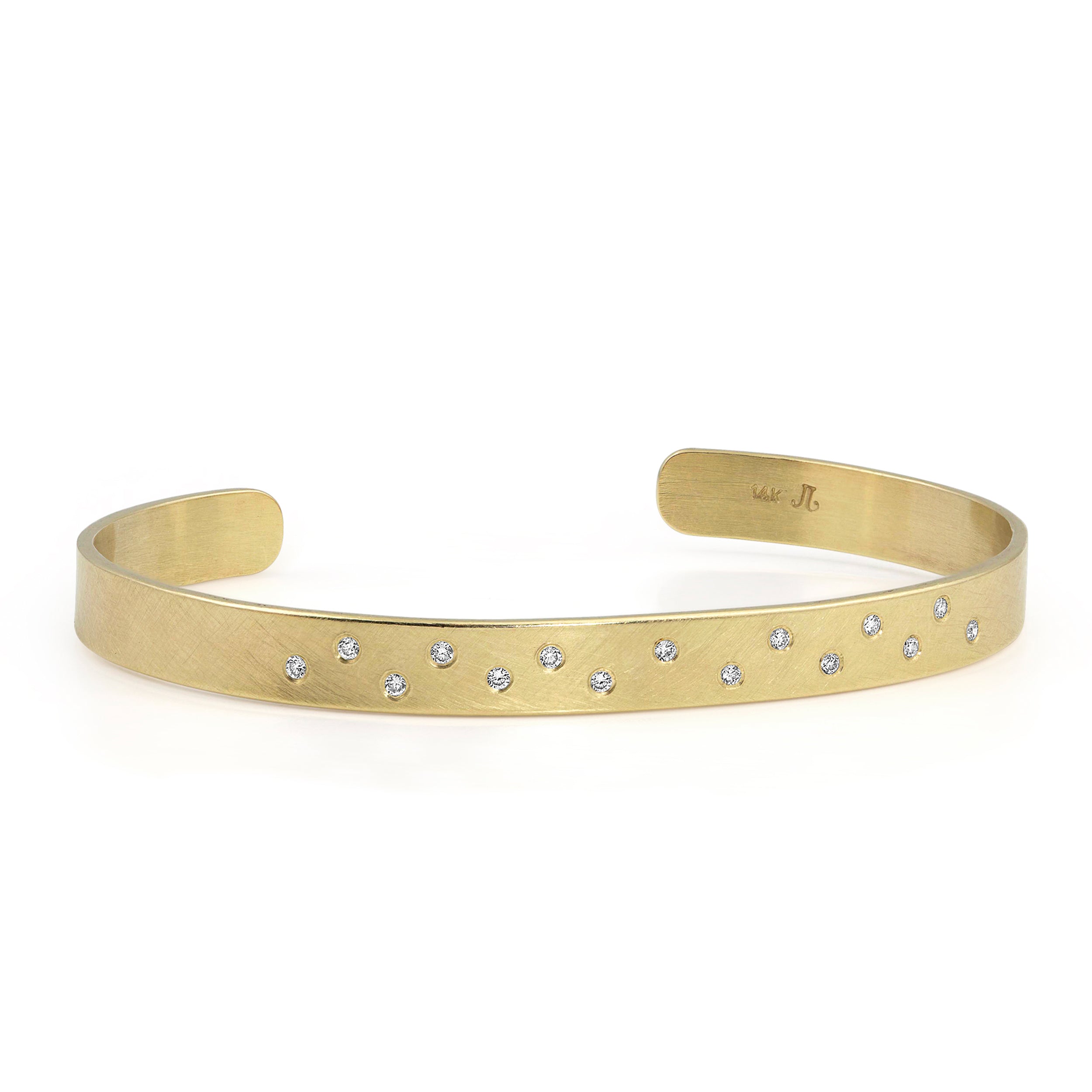 14k yellow gold hammered cuff bracelet with scattered white diamonds on white background