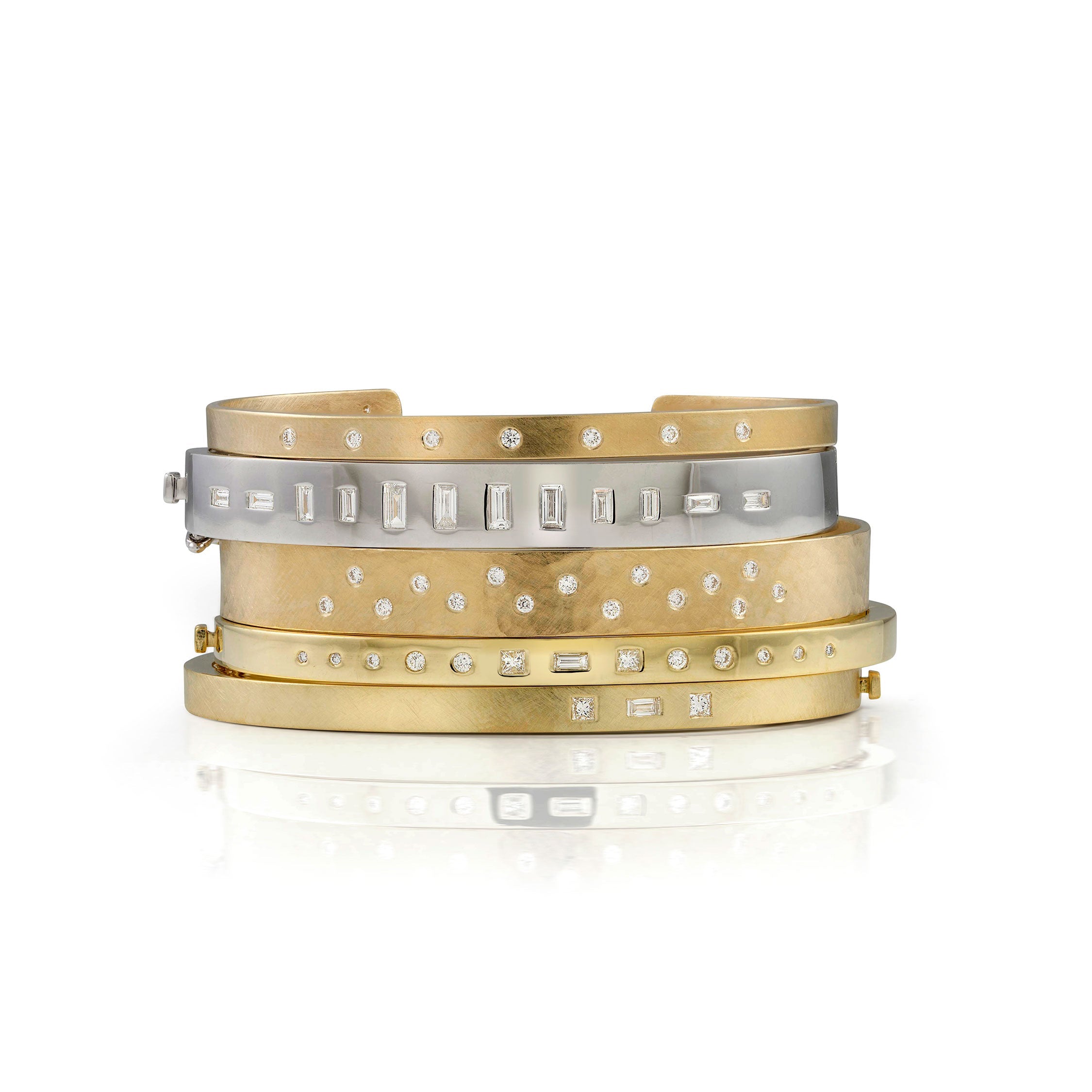 14k yellow gold hammered cuff bracelet with scattered white diamonds stacked with gold cuffs and bangles by julez bryant on white background