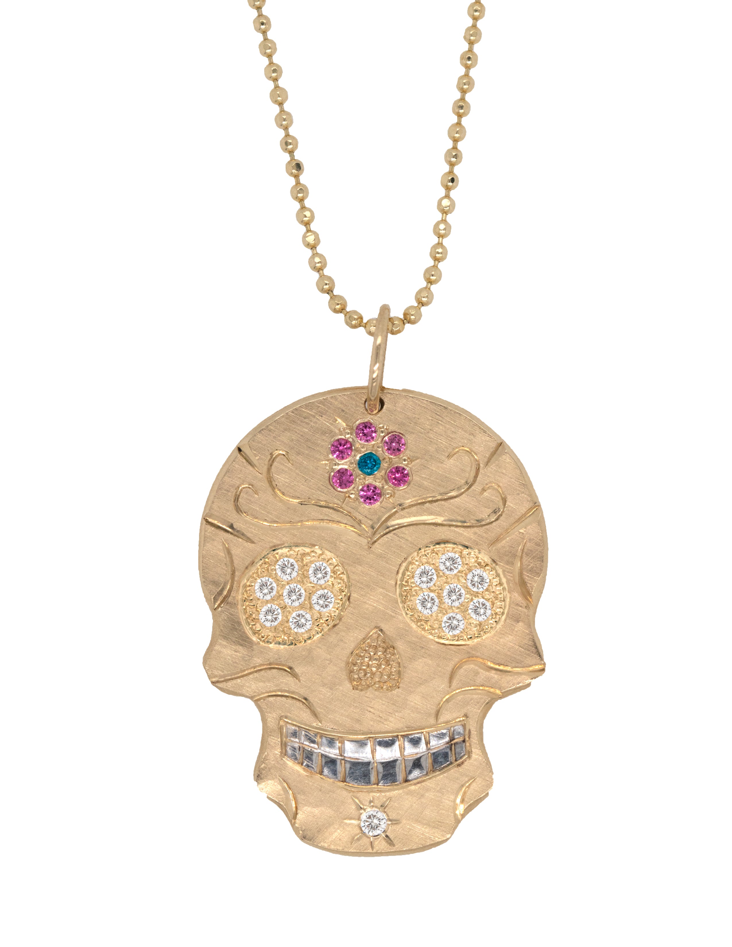 14k solid Gold skull pendant necklace with mixed color sapphires and diamons. Hand engraved details. Shown on a white background