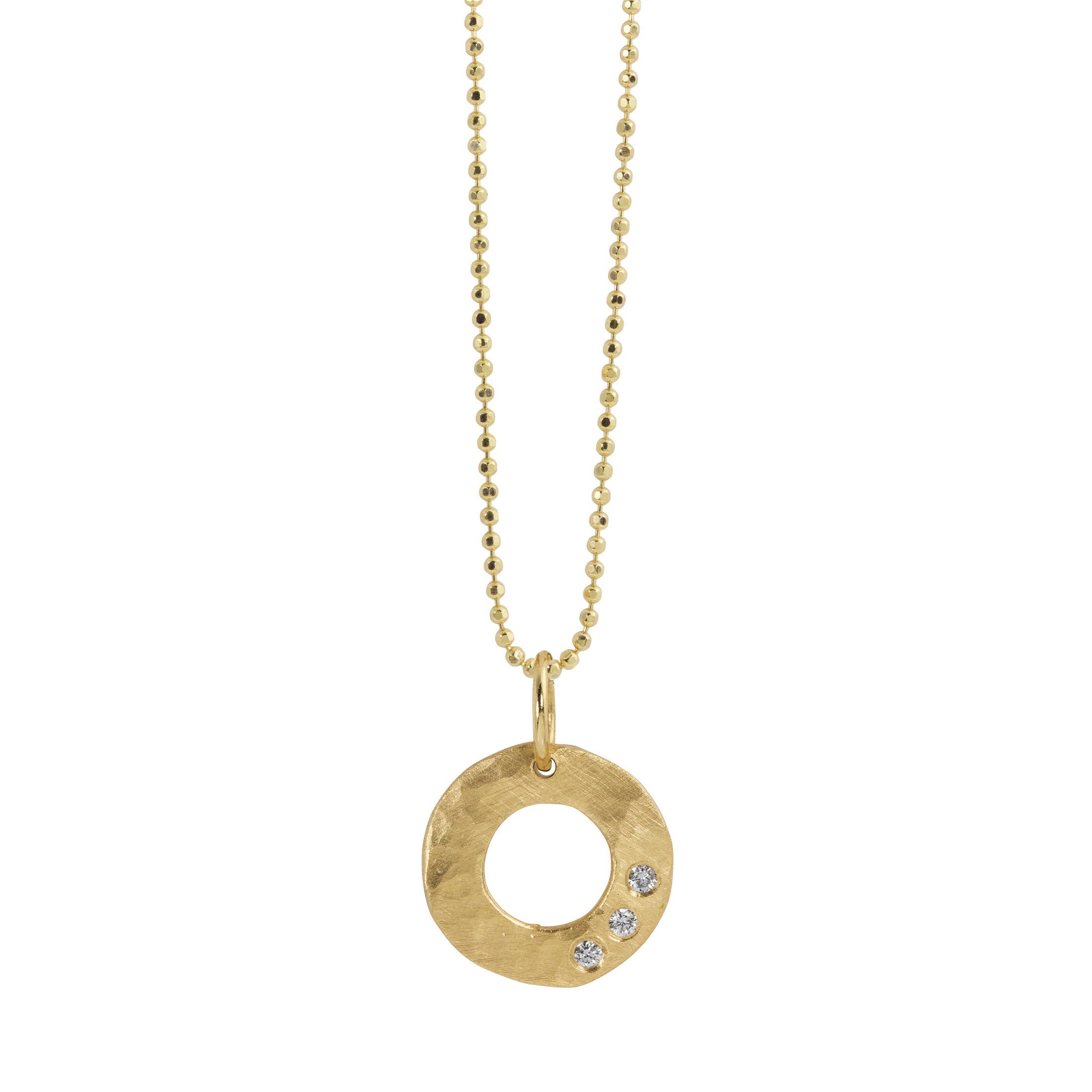14k yellow gold open circle pendant with hammered finish and three white diamonds on a white background