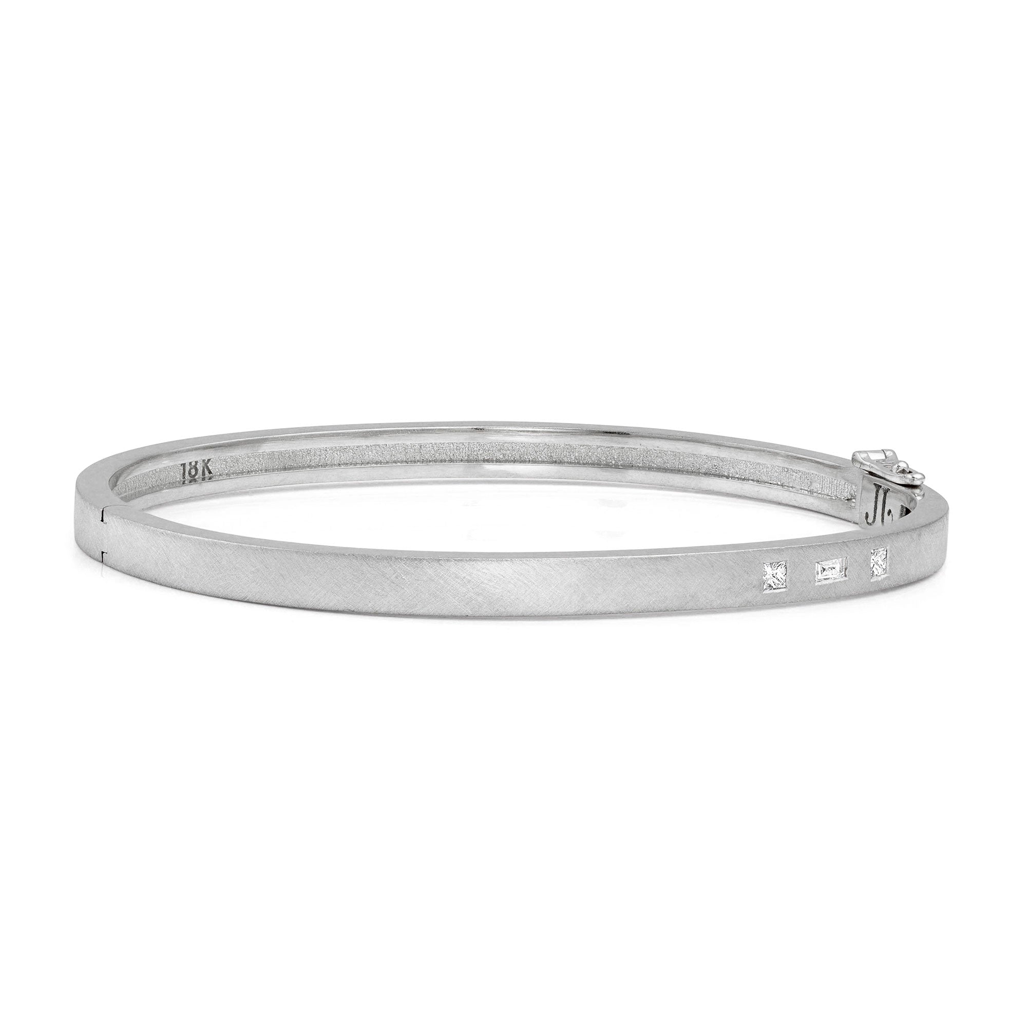 18k white gold hinged bangle bracelet with baguette and princess cut white diamonds on white background
