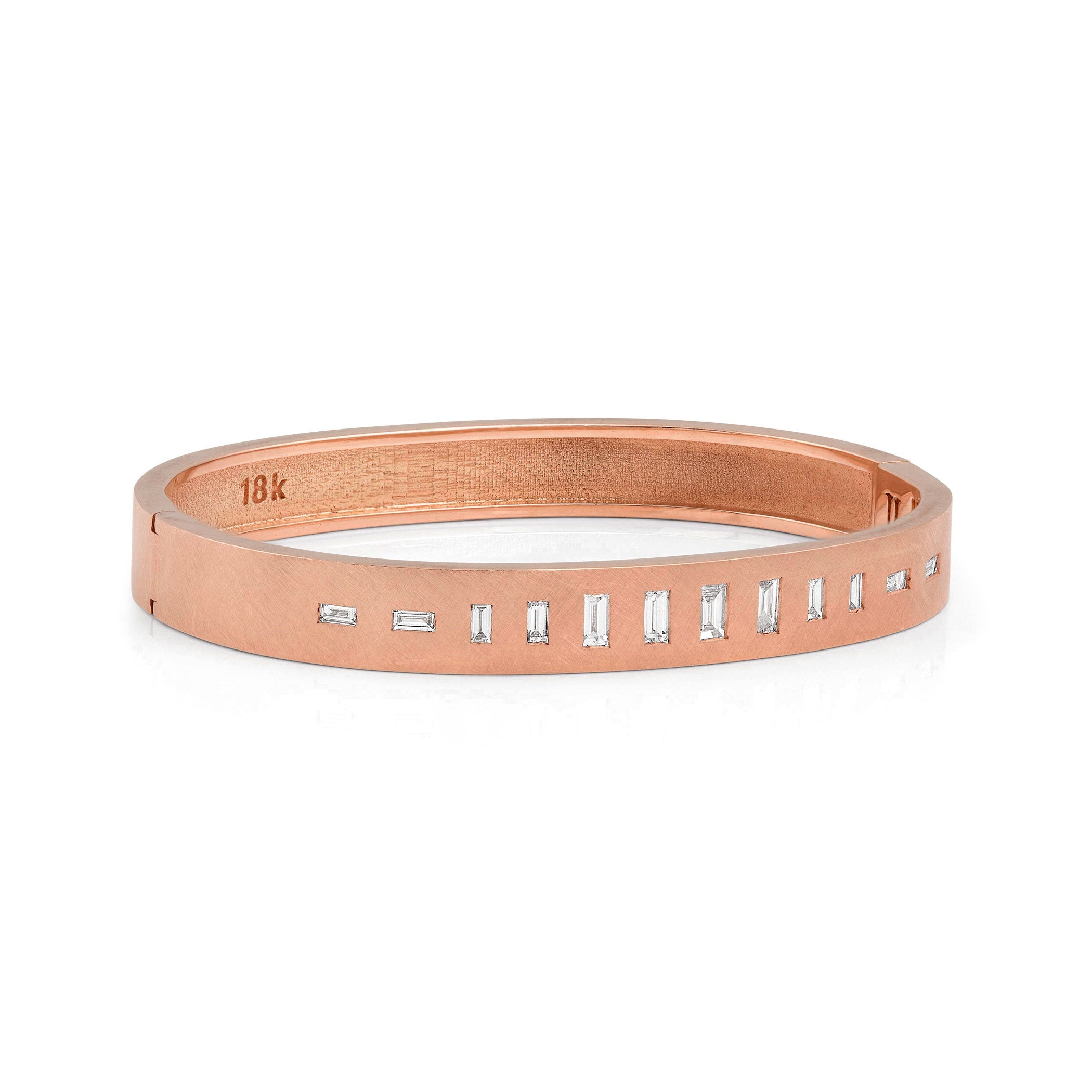 18k rose gold hinged bangle bracelet with baguette cut white diamonds on white background