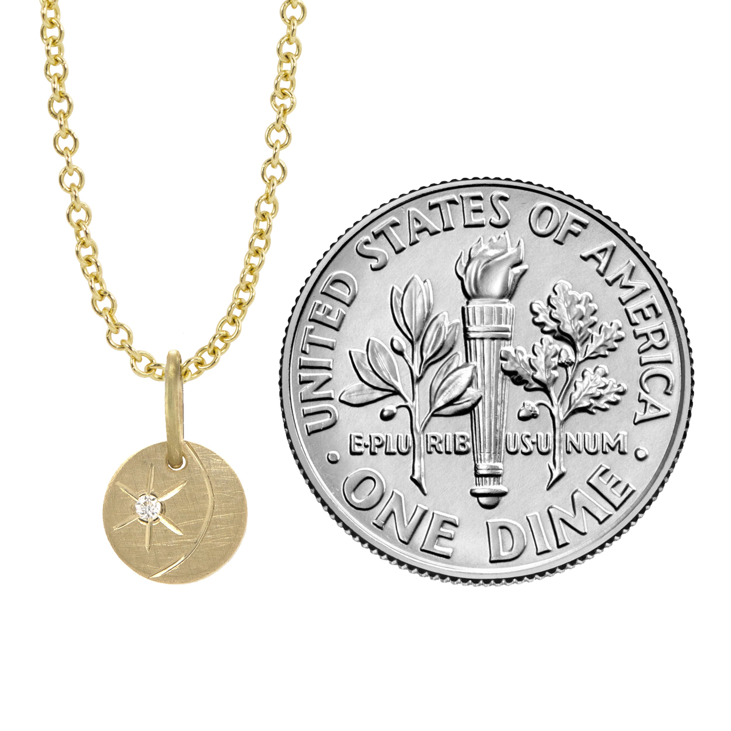 14k yellow gold round pendant featuring a diamond starburst with an etched crescent moon on a white background with size indicator
