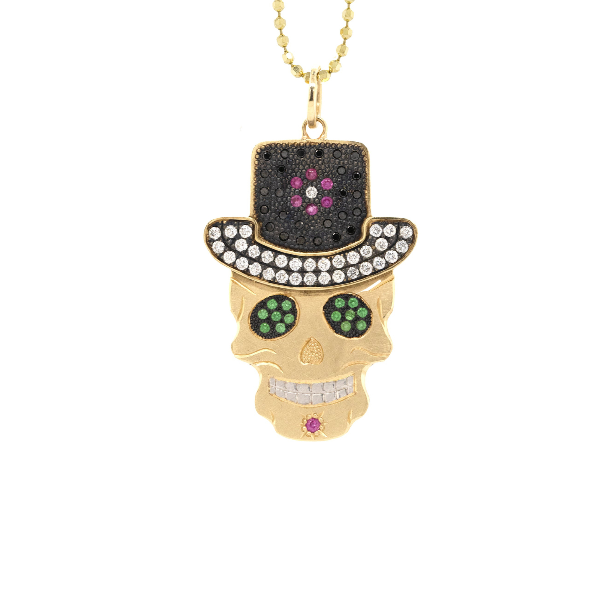 Skull pendant with top hat and gemstones on a white background