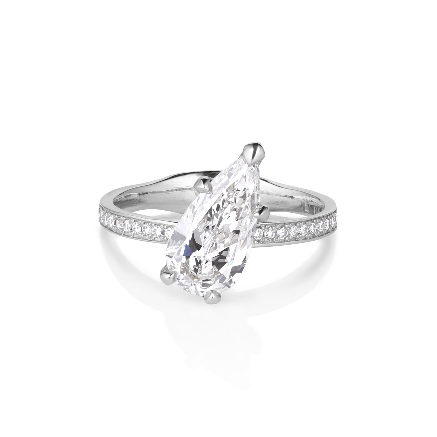 14k white gold ring with a large teardrop shaped diamond set tilted with milgrain ernity band shown on a white background