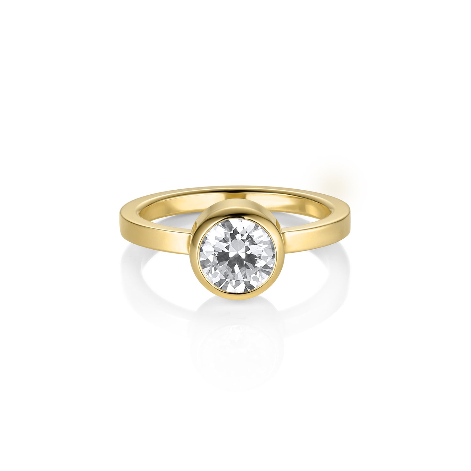 Gold ring with a diamond on a white background