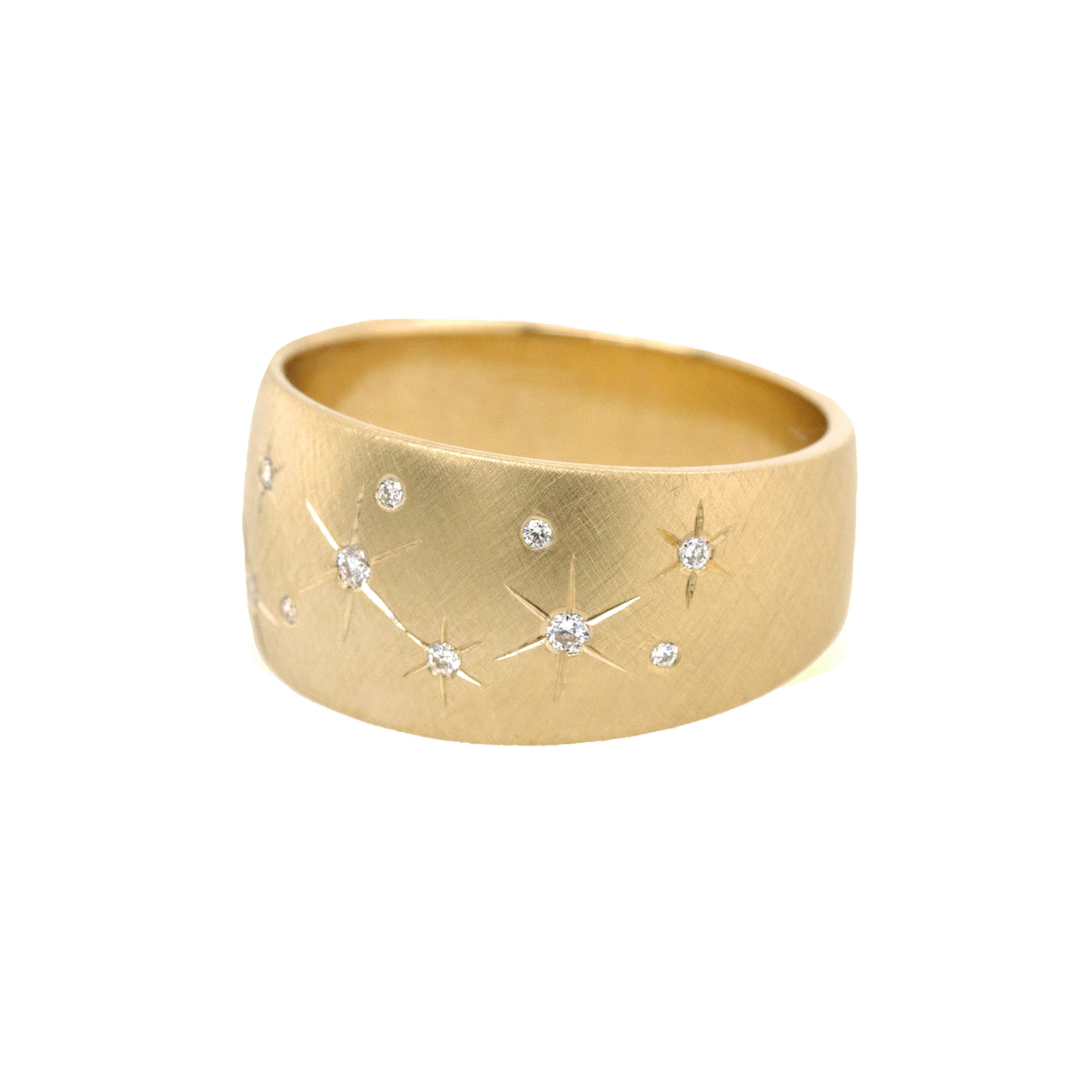 14k gold puffed wide band ring with scattered engraved diamond star side view on white background