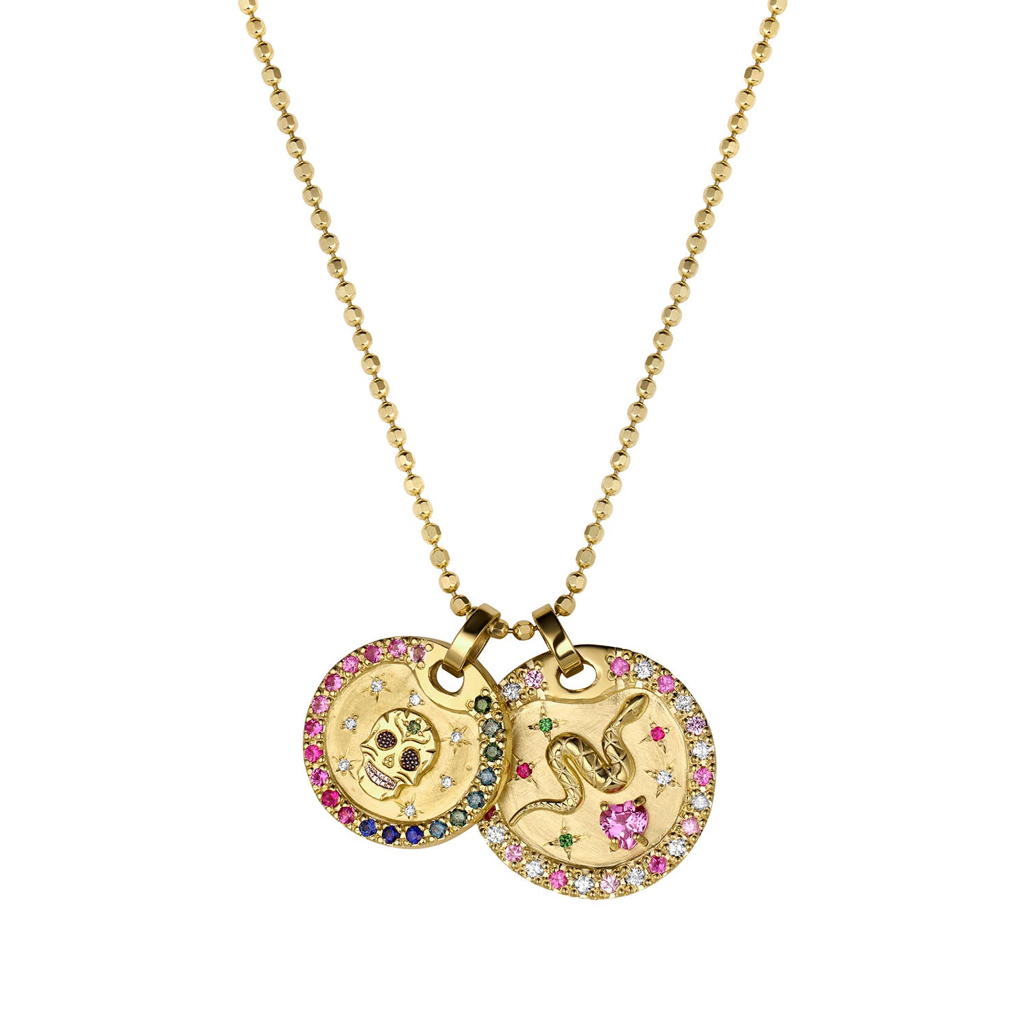 Gold double pendant necklace with colorful gemstones and white diamonds featuring a skull and snake design andsapphire border. White diamond starburst accents. Shown on thick diamond cut ballchain on a white background.
