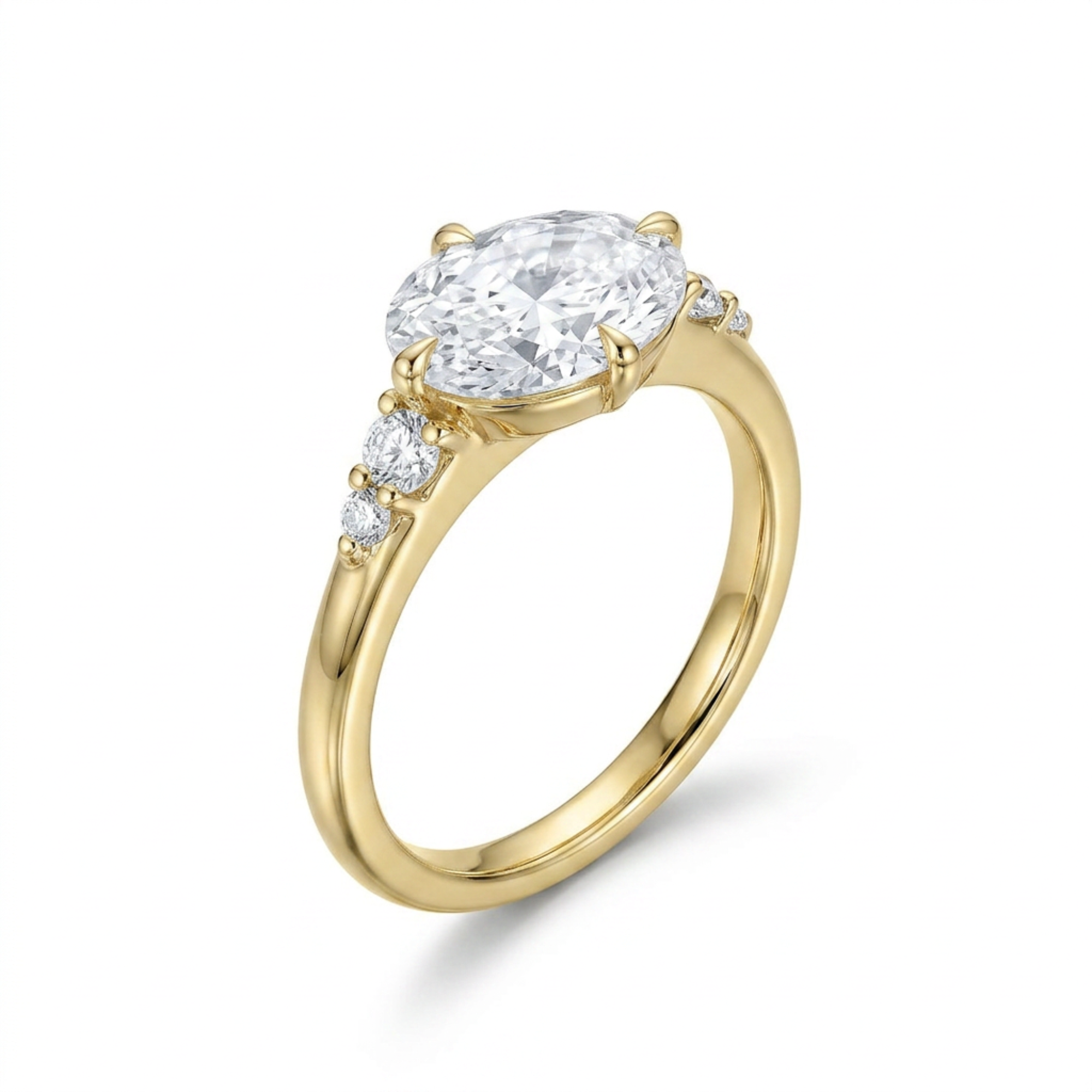 3/4 view of five stone large oval sideways set white diamond with round accents either side 14k gold engagement ring on white background