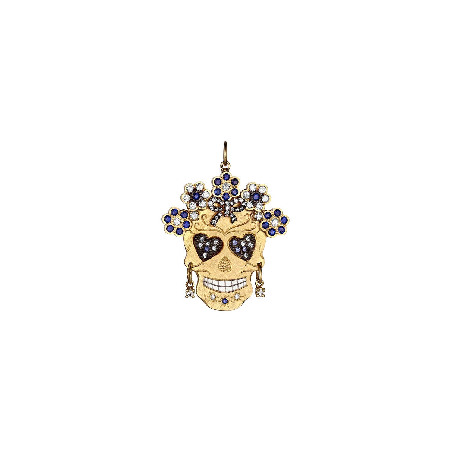 Elaborate gemstone encrusted Skull-shaped pendant necklace with white diamond and blue sapphires features a halo of flowers, bow and heart shaped eyes wearing diamond earrings pendant only shown on white background
