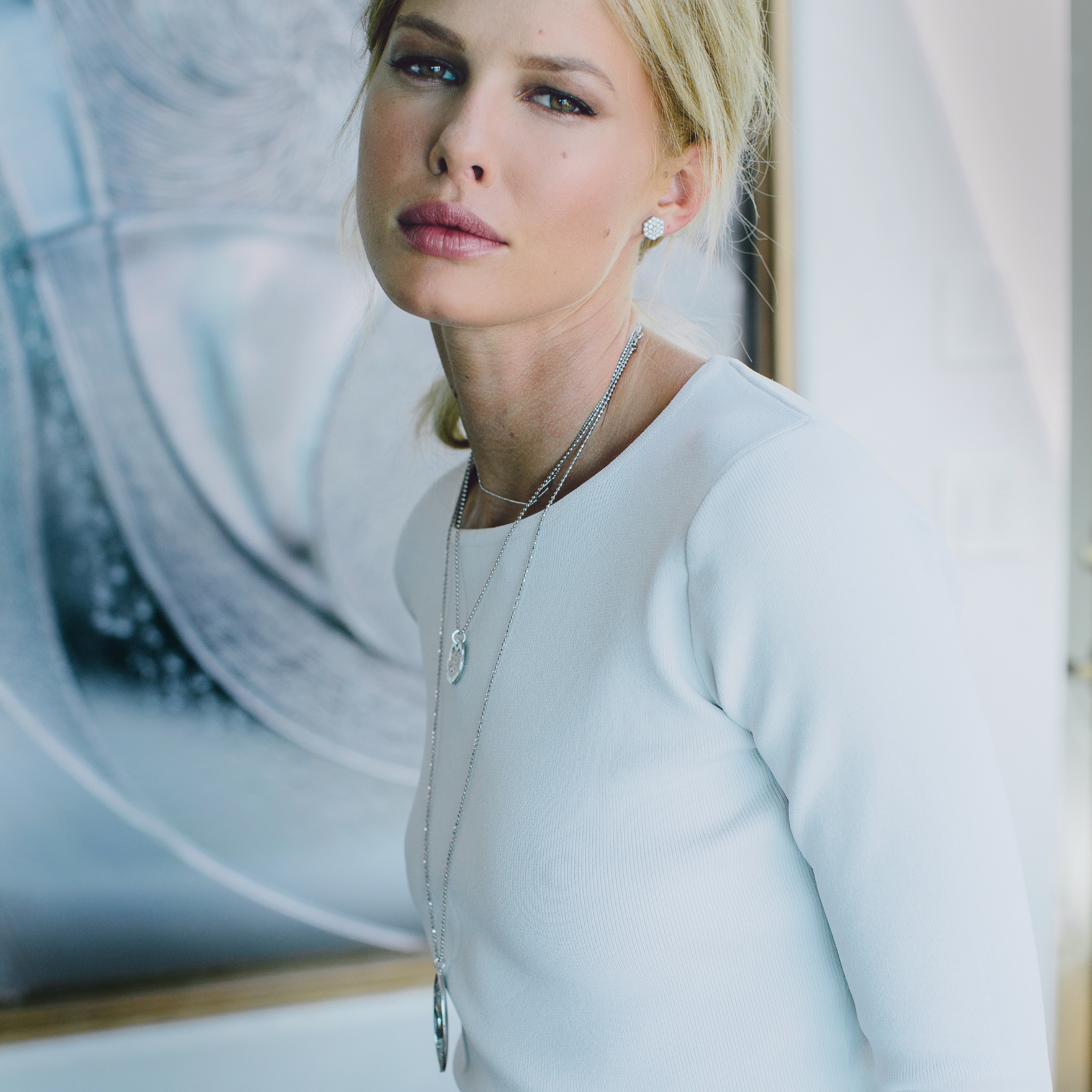 14k gold diamond hexagon cluster stud earrings on model in lifestyle shot