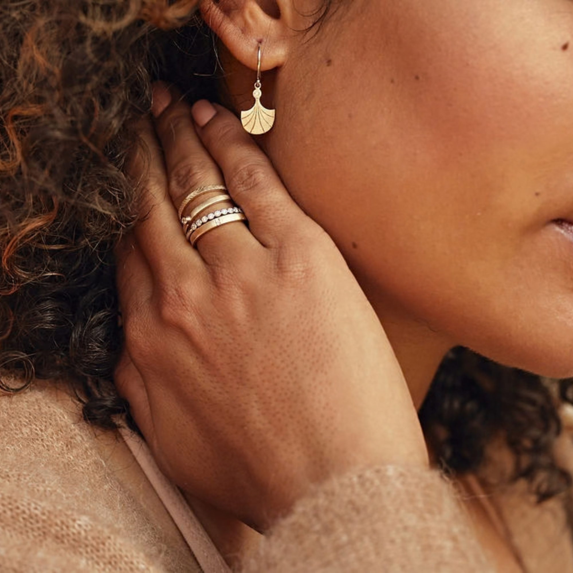 14k Yellow Gold Etched Satin Stacker Ring stacked with other julez bryant rings on model in lifestyle shot