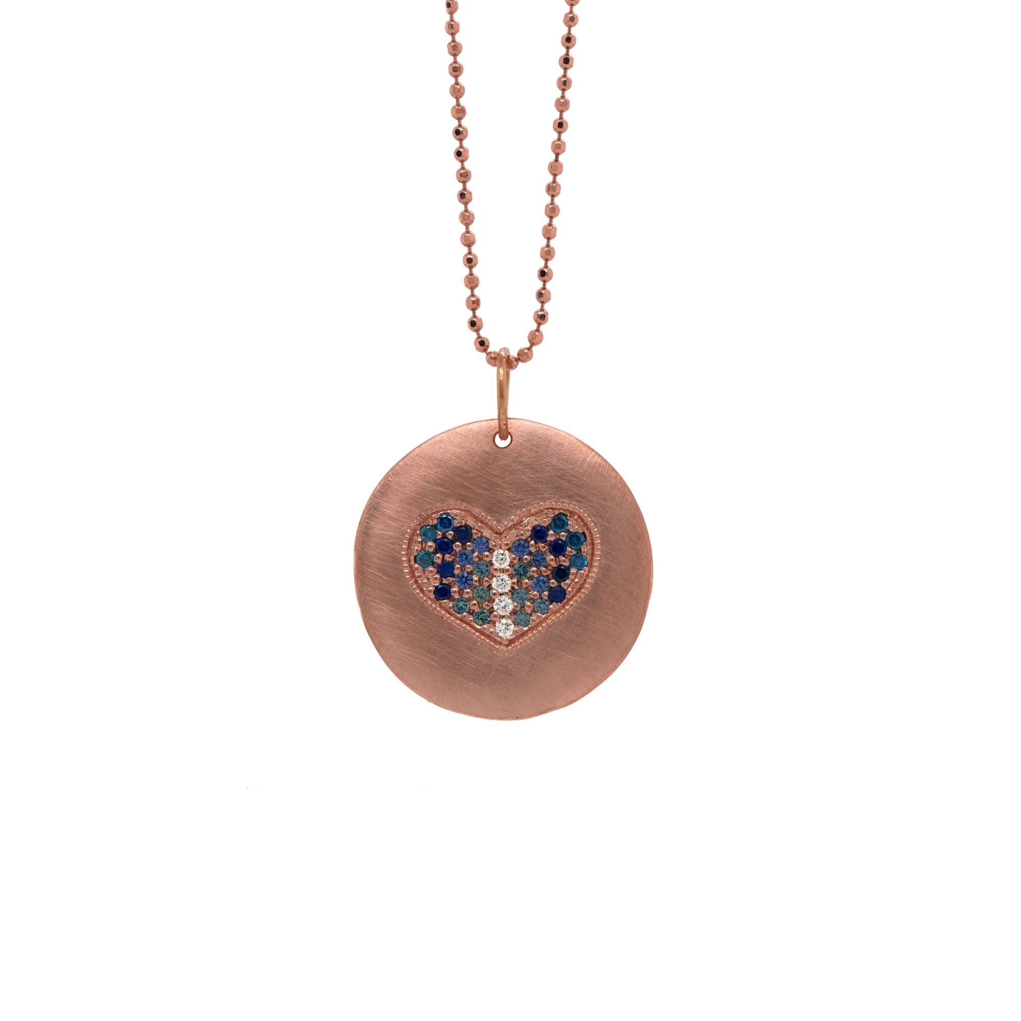 14k rose gold pendant with heart-shaped paved set blue sapphires on diamond cut ball chain on white background