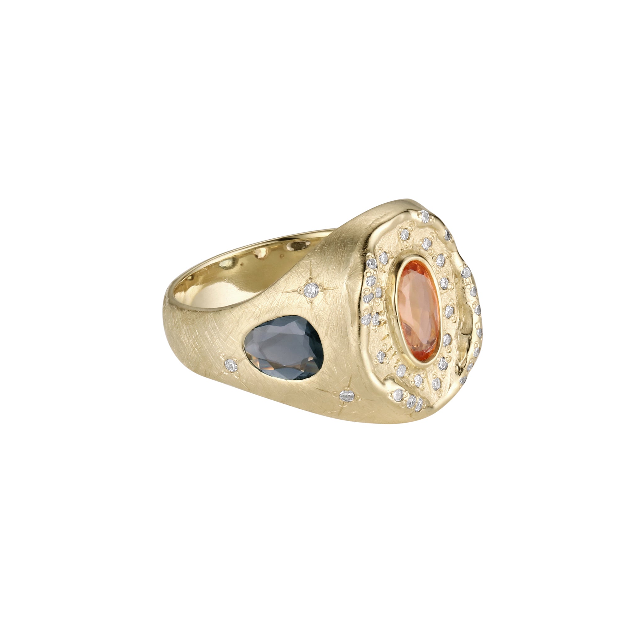 Gold ring with two colored gemstones on a white background