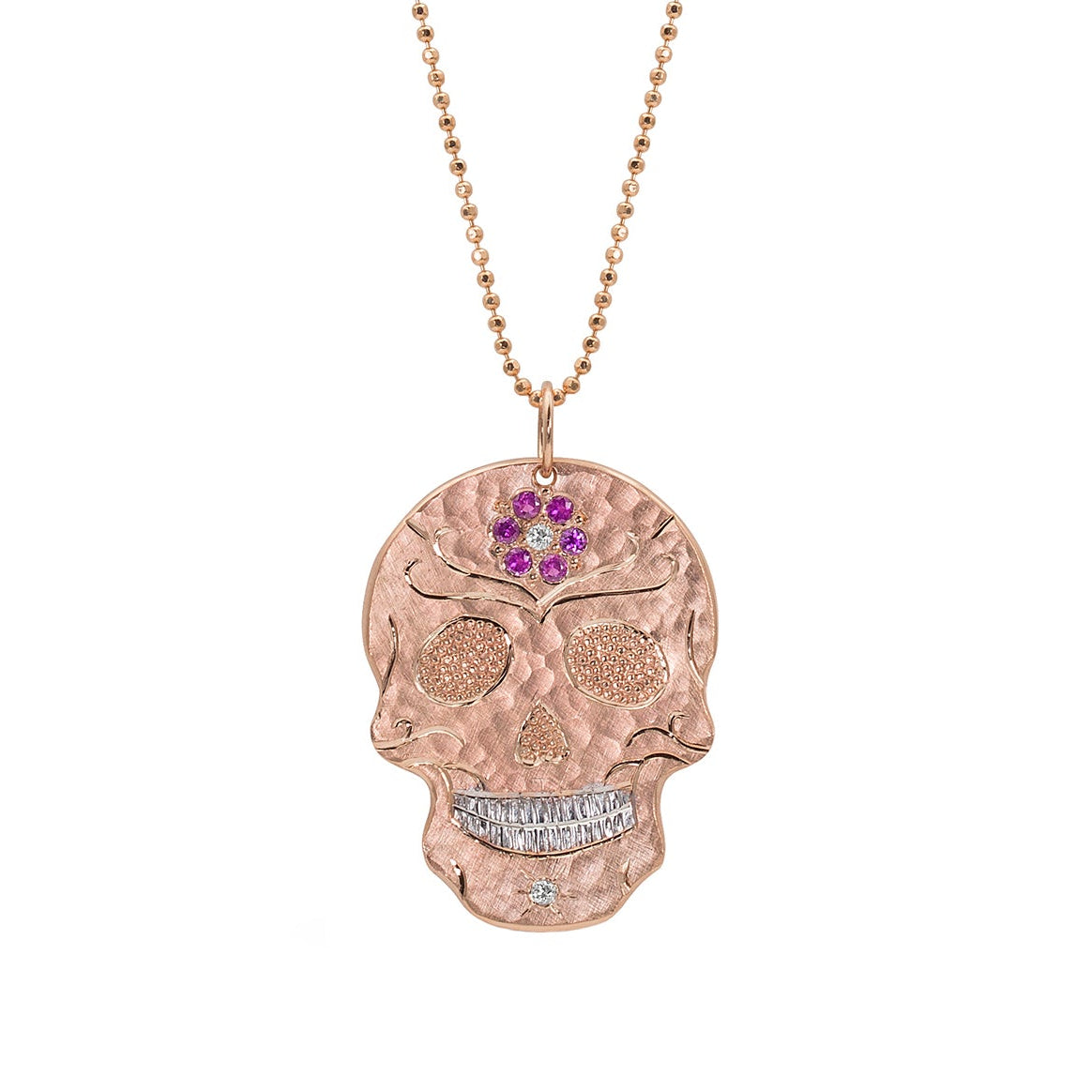 14k rose gold skull pendant with embedded pink sapphire flower forehead, pave set precious gem eyes on a white background