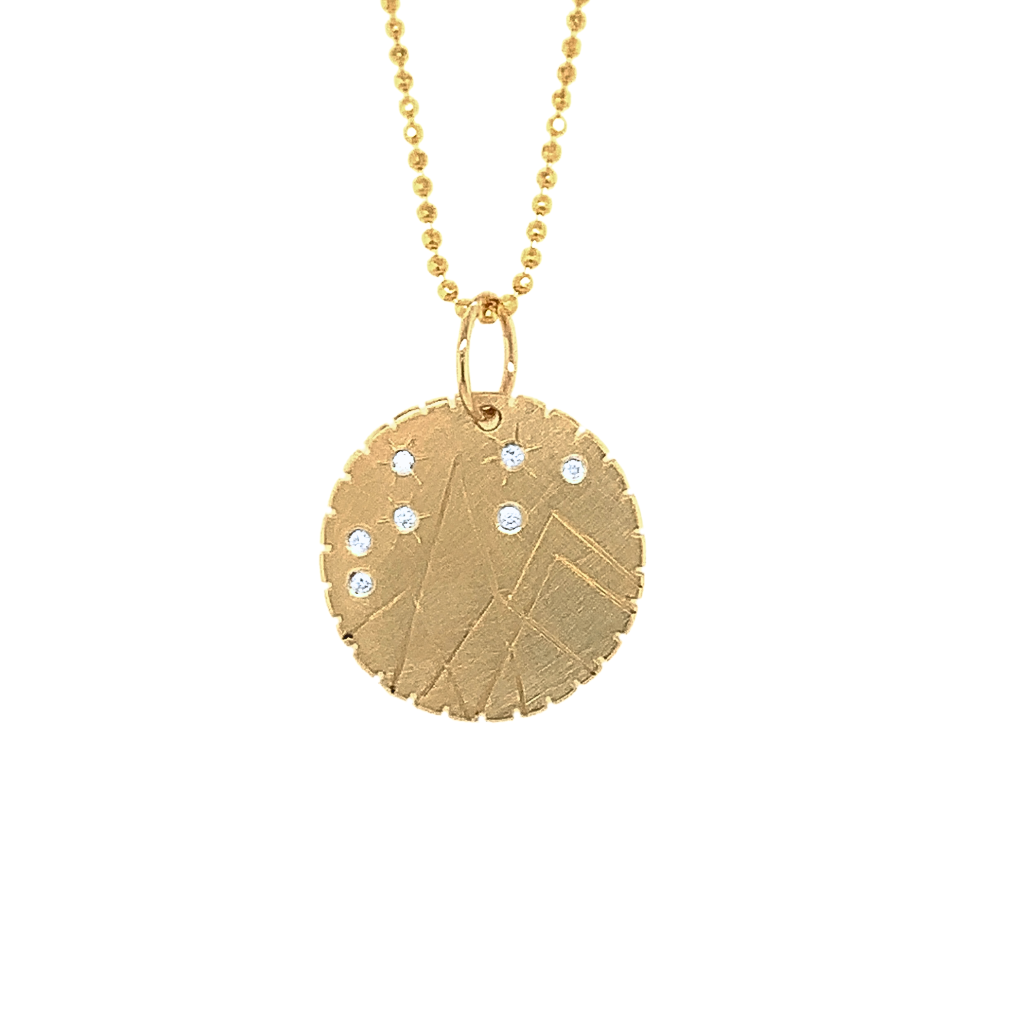 14k yellow gold round pendant with hand etched mountains and white diamond starbursts on a white background