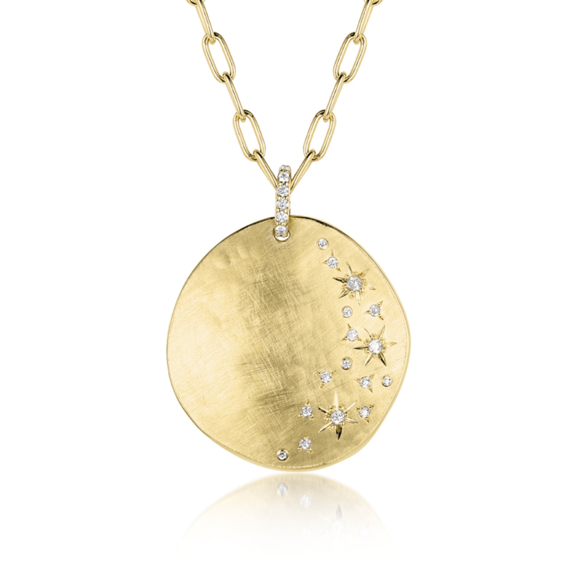 Extra large 14k yellow gold concave round medallion pendant scattered white diamond stars and pave diamond bale hanging on an elongated link chain. Shown on white background.
