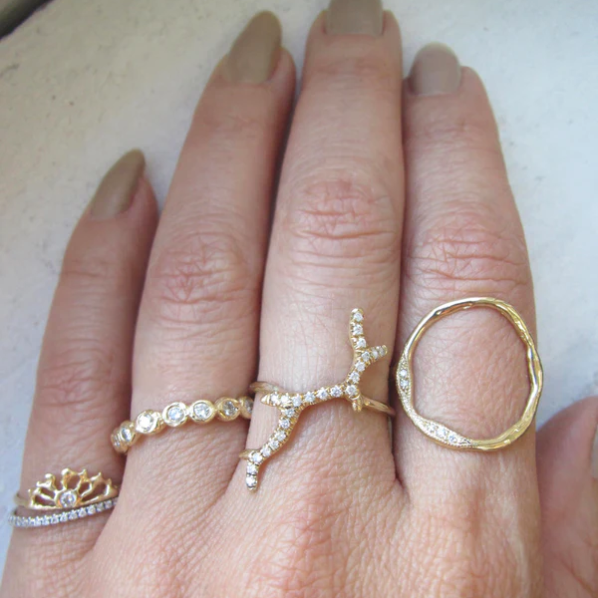 14k yellow gold full open circle ring with white diamonds on model in lifestyle shot