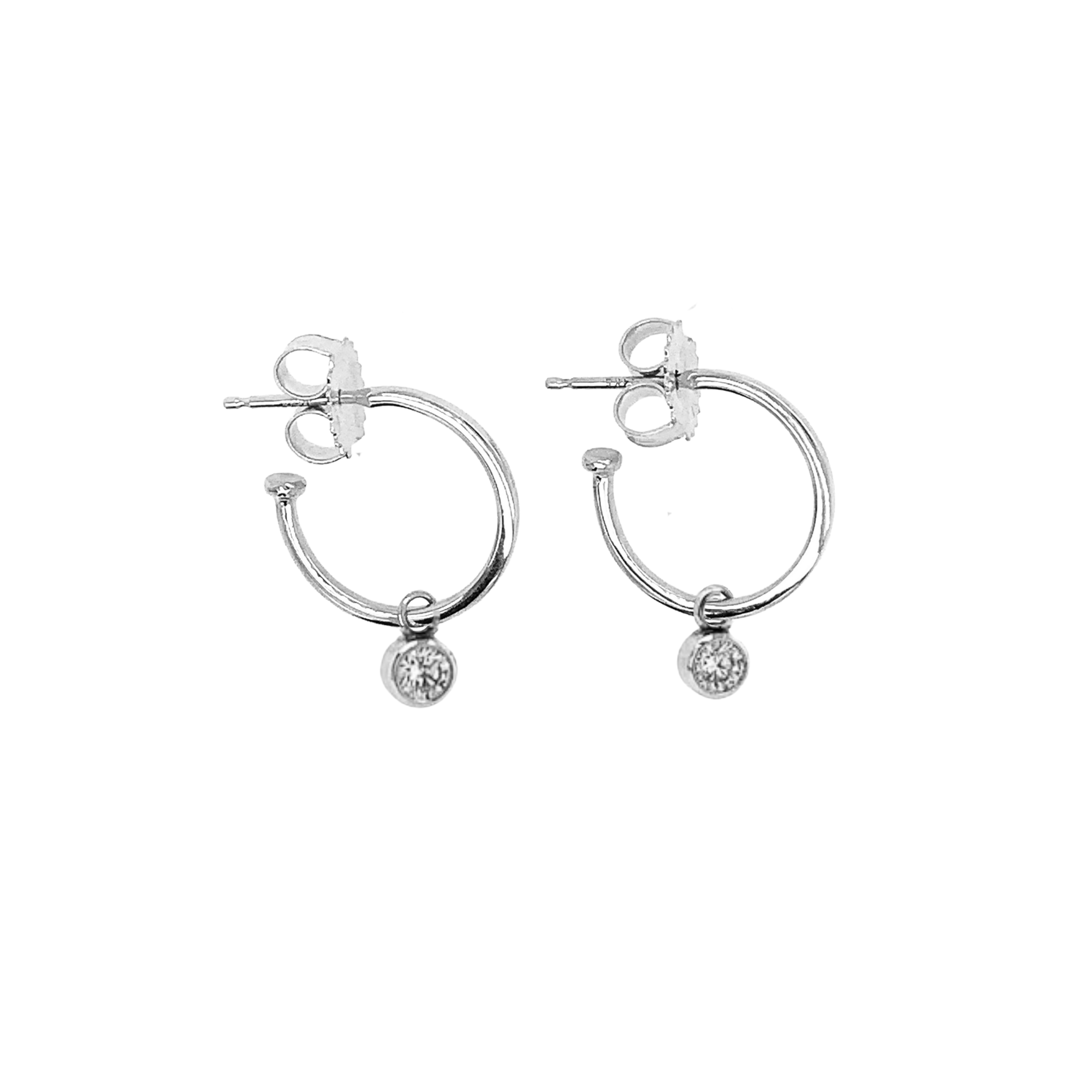 14k white gold hoop earrings with bezel set white diamond charms on white background