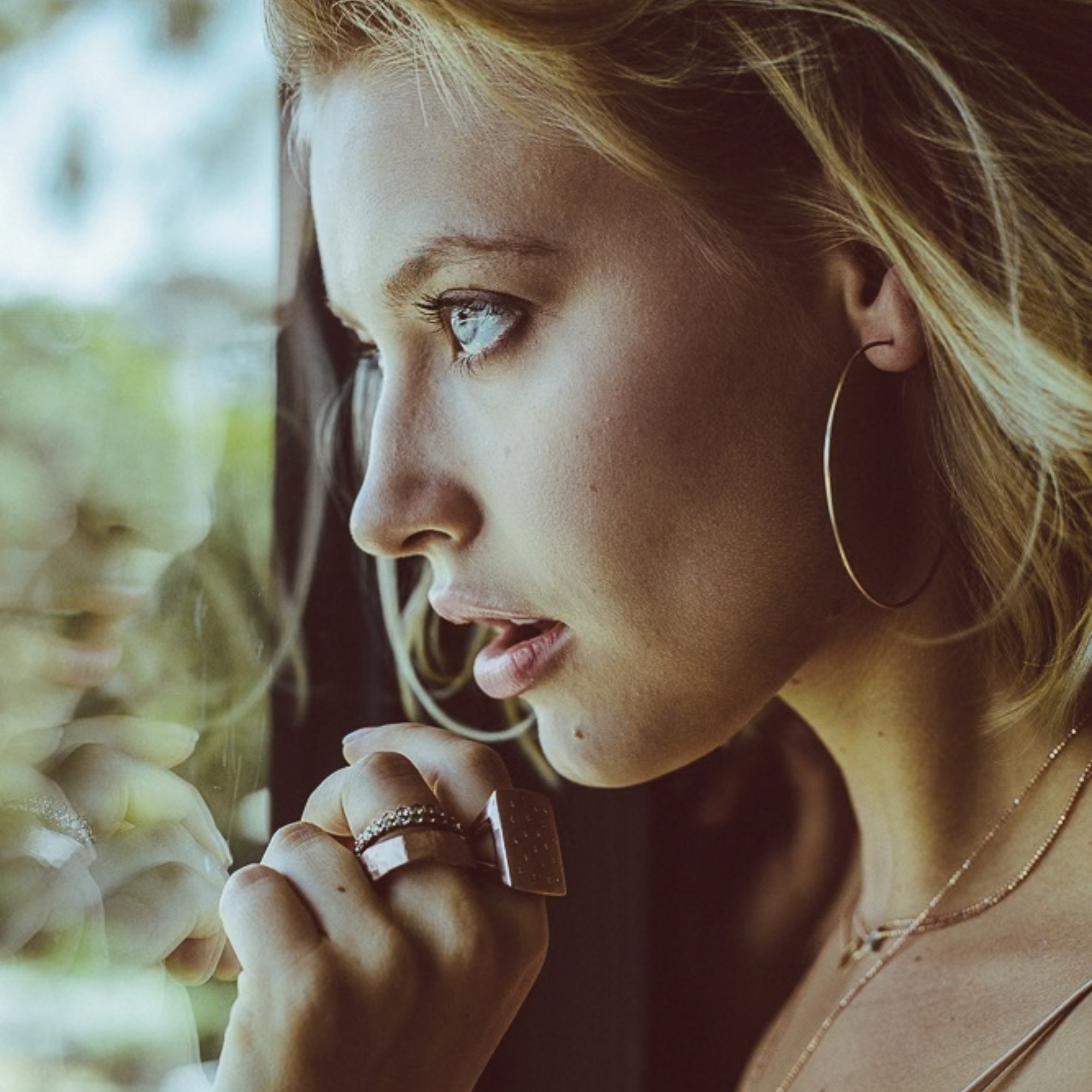 14k gold hammered wire hoop earrings styled with refe ring and no 1 ring on model in lifestyle shot